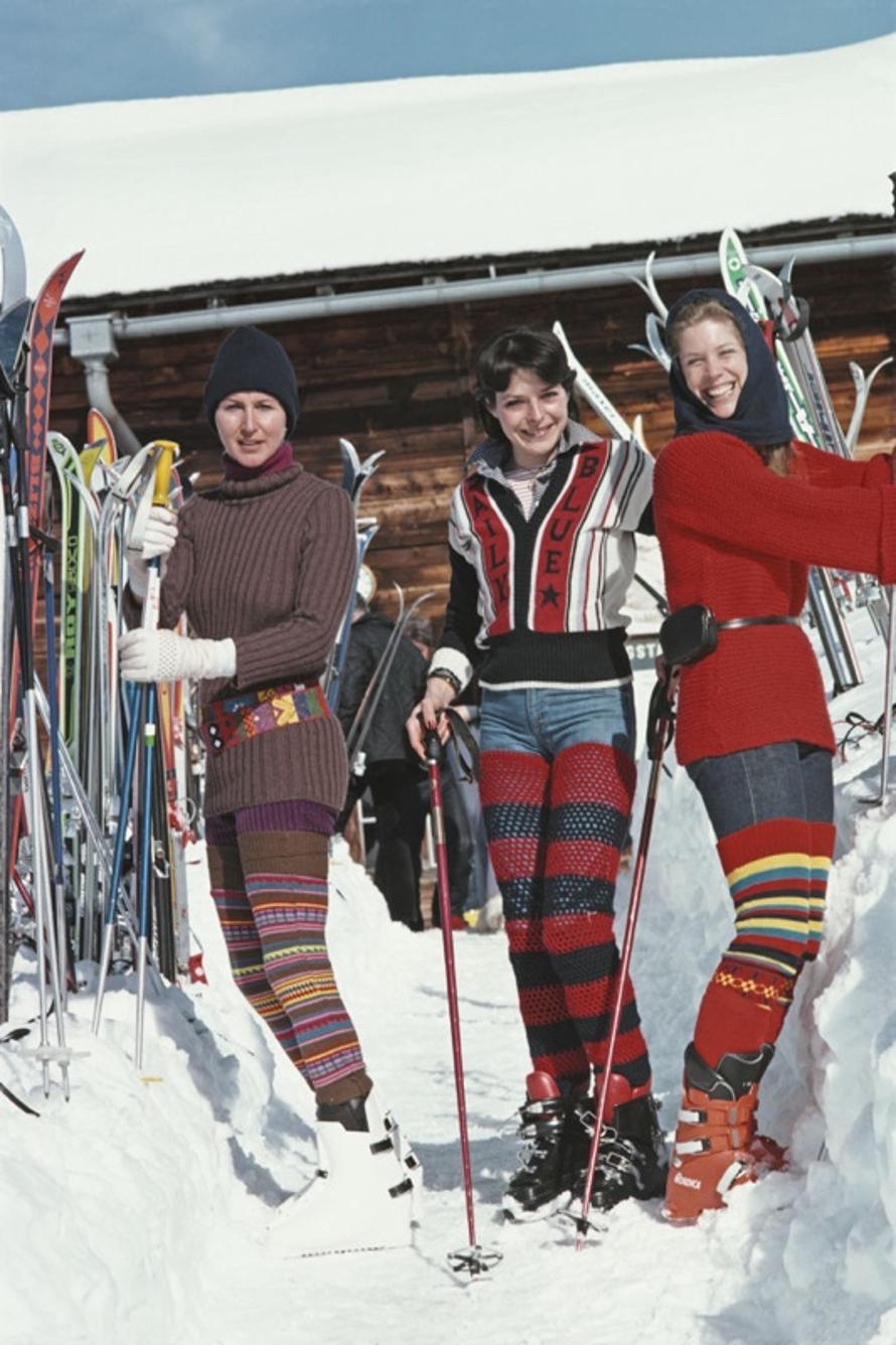 Skiing In Gstaad 
1977
by Slim Aarons

Slim Aarons Limited Estate Edition

Christine Camerana, Caroline Stoop, and Christine Semenenko Warrender prepare for a day on the slopes in Gstaad, Switzerland, February 1977.

unframed
c type print
printed