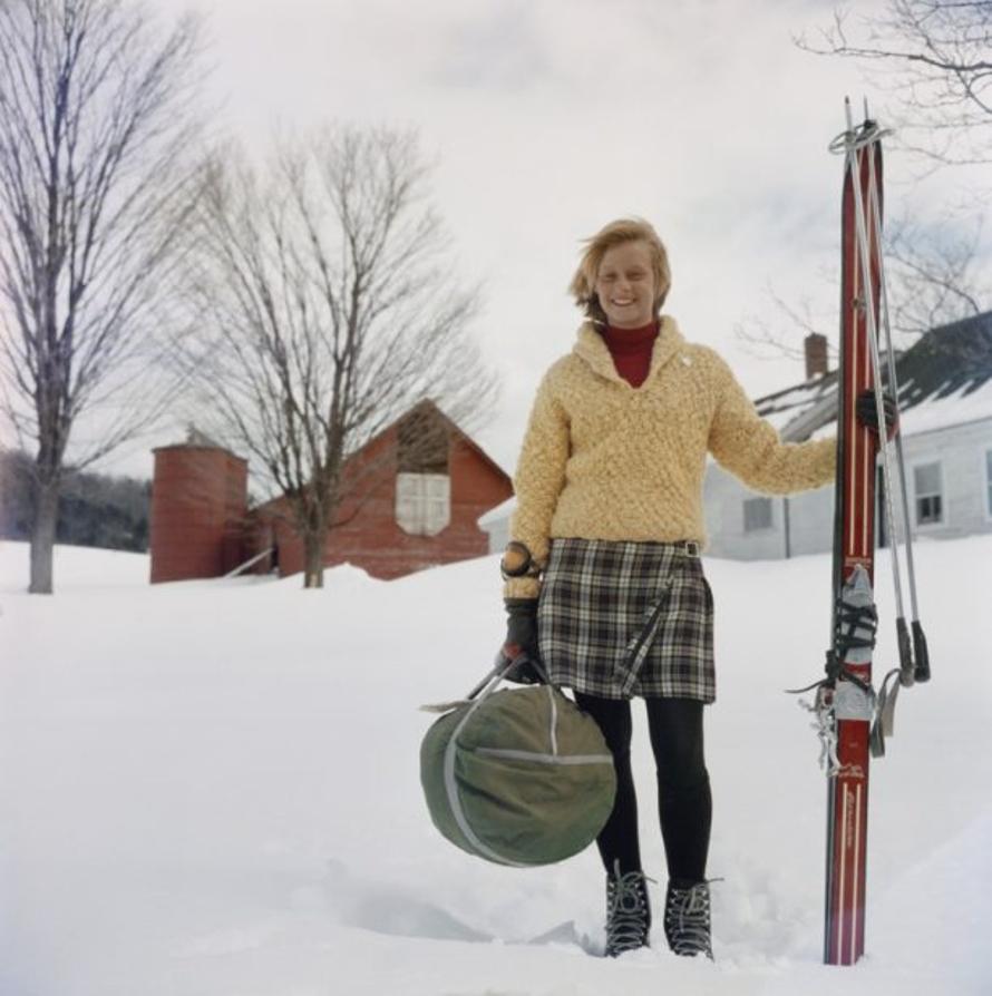 Skiing Waitress 
1960
by Slim Aarons

Slim Aarons Limited Estate Edition

Ski ‘bum’ Alice Clement, a waitress and dishwasher at Stowe, Vermont when not on the slopes, carrying her skis on the way to a run, circa 1960. A Wonderful Time – Slim