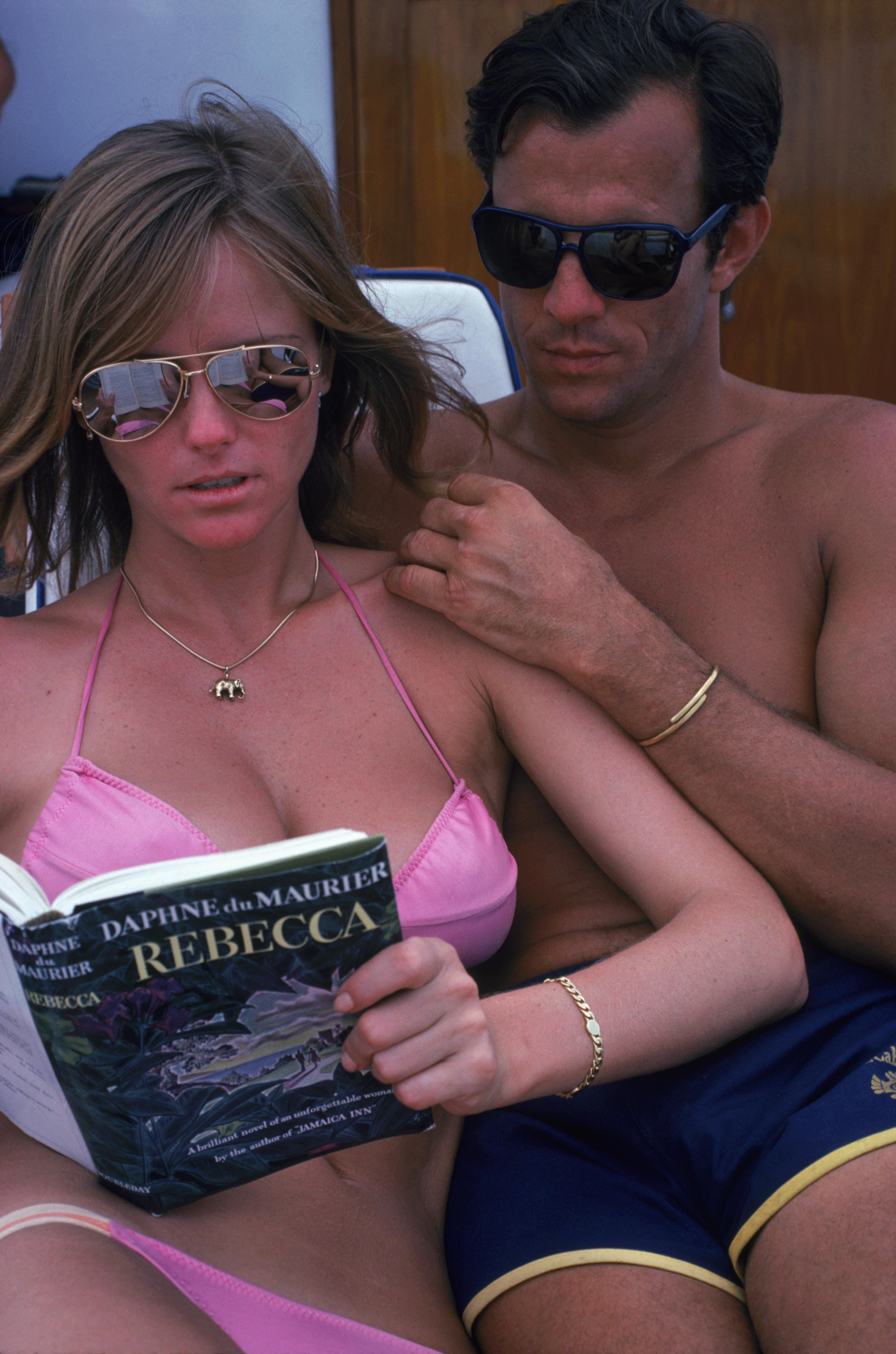 Slim Aarons
A Relaxing Read, 1982
Chromogenic Lambda print
Estate stamped and hand numbered edition of 150 with certificate of authenticity. 

Cheryl Tiegs and her husband Peter Beard on the island of Turks and Caicos Islands in the West Indies,