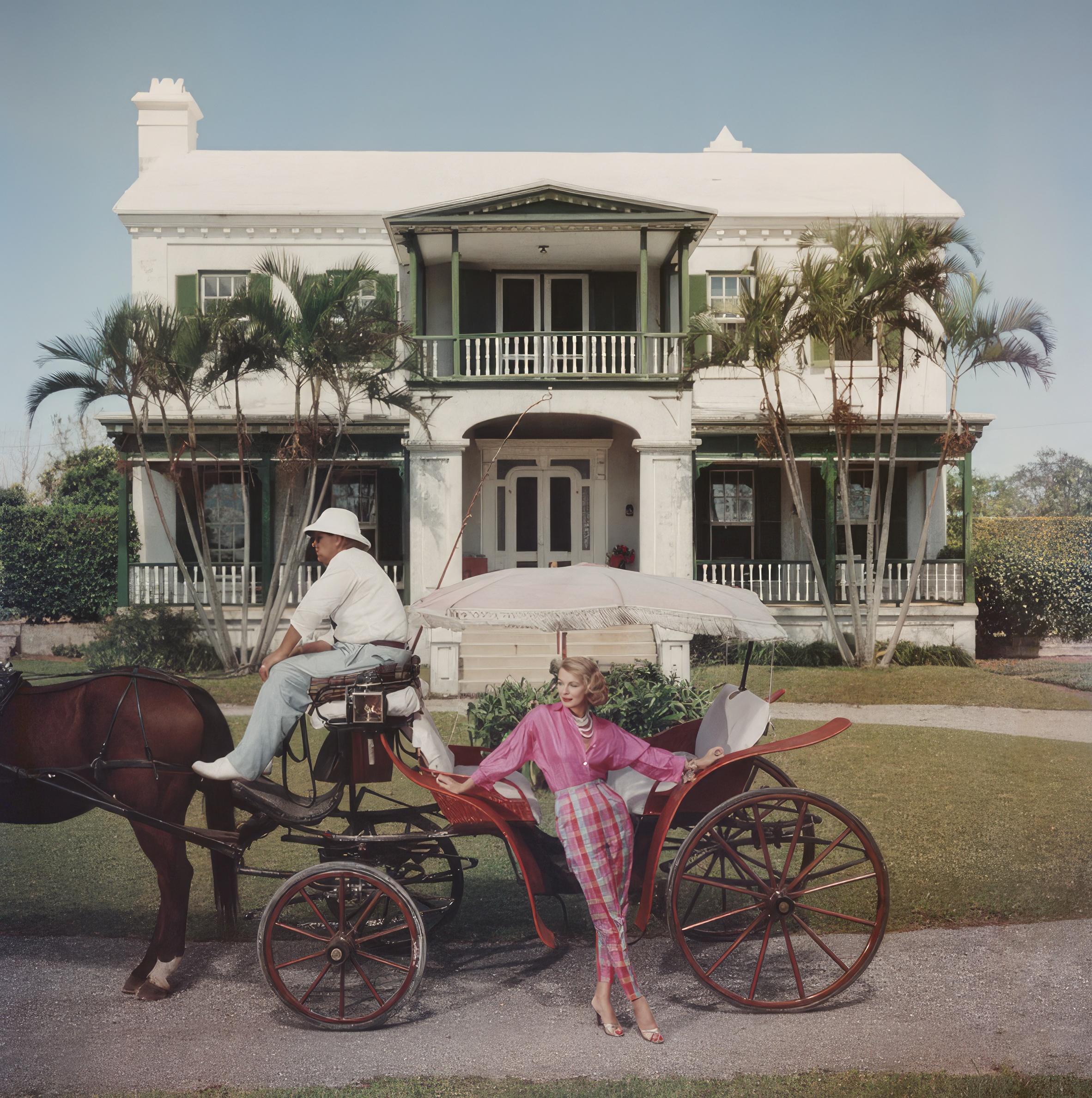 Bermudian Hostess
1957
C-print
Estate stamped and hand numbered edition of 150 with certificate of authenticity from the estate.   

Polly Trott Hornburg in front of her father's typical Bermudian house. She is wearing her own design of Thaibok