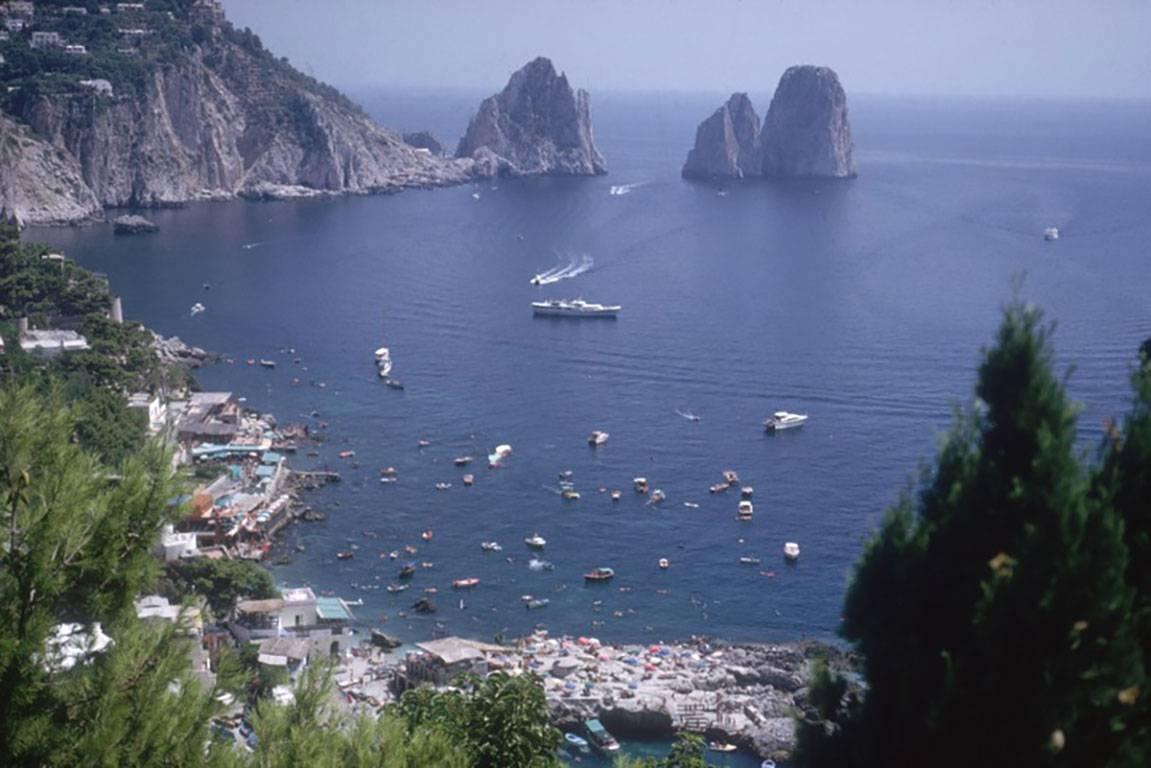Faraglioni Rocks on the Italian island of Capri, 1958.

Estate stamped and hand numbered edition of 150 with certificate of authenticity from the estate.   

Slim Aarons (1916-2006) worked mainly for society publications photographing "attractive