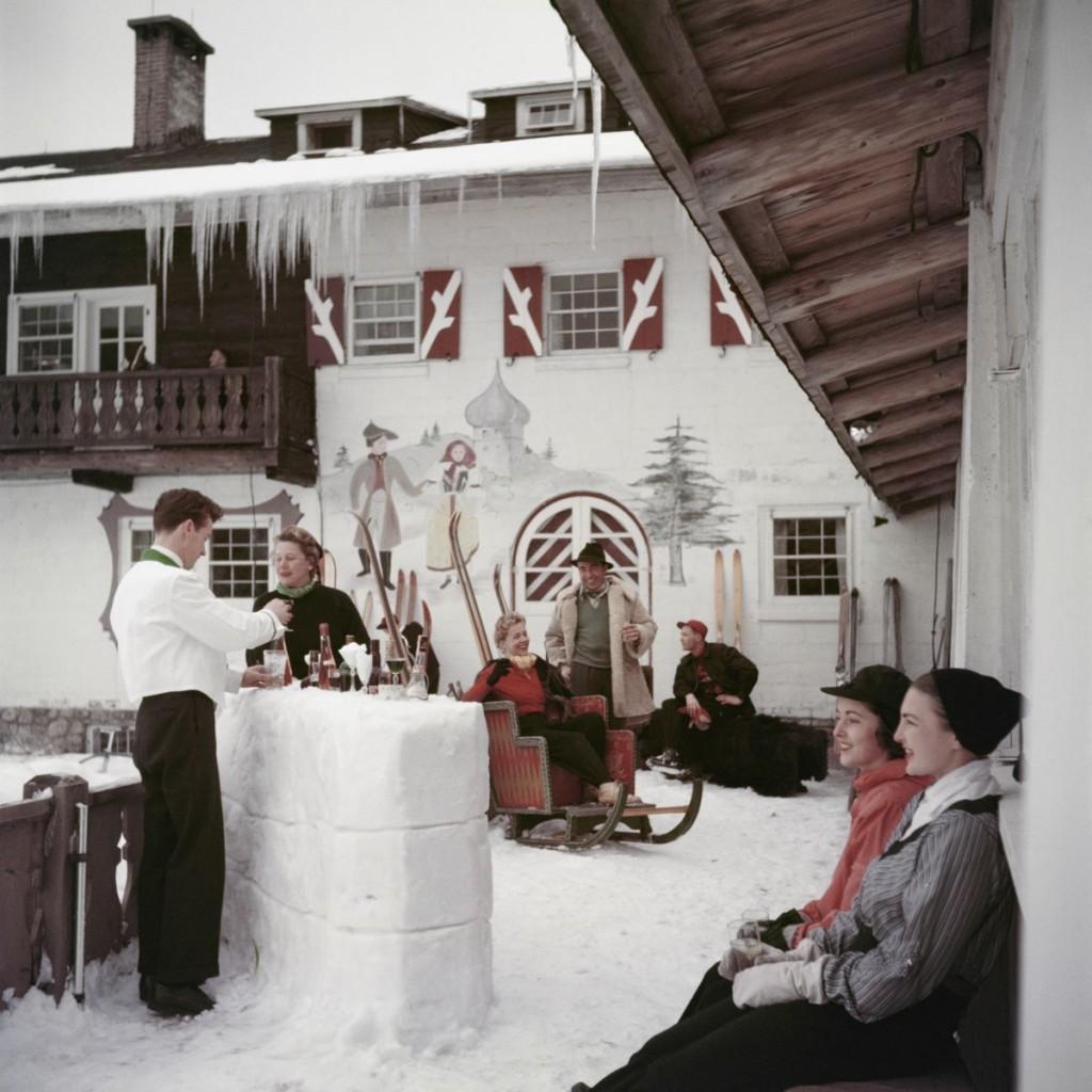 Slim Aarons - Chilled Beverages - Estate Stamped 

Limited Edition Estate Stamped Print (edition size 1/150). 

Guests drinking at the Snow Bar outside the Mittersill Club on Cannon Mountain, 
New Hampshire, United States, 1955.

In his words, he