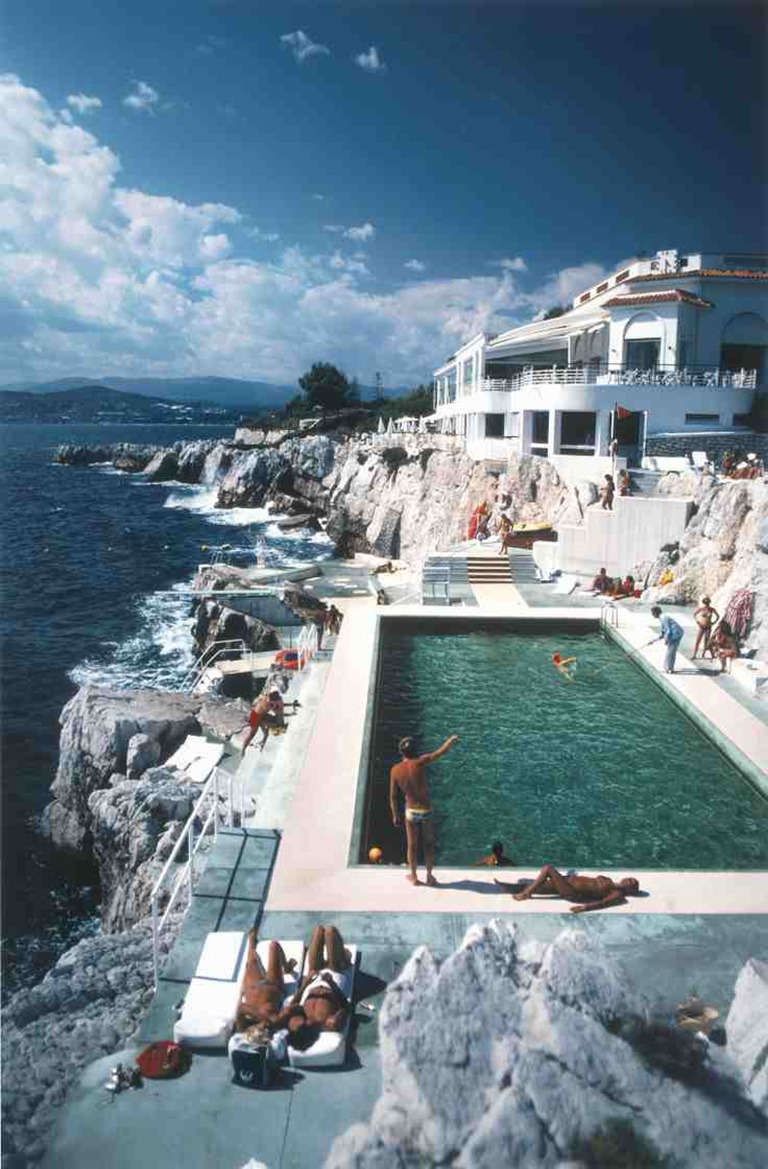 Guests by the pool at the Hotel du Cap Eden-Roc, Antibes, France, August 1976.

Slim Aarons worked mainly for society publications, taking pictures of the rich and famous both before and after serving as a photographer for the US military magazine