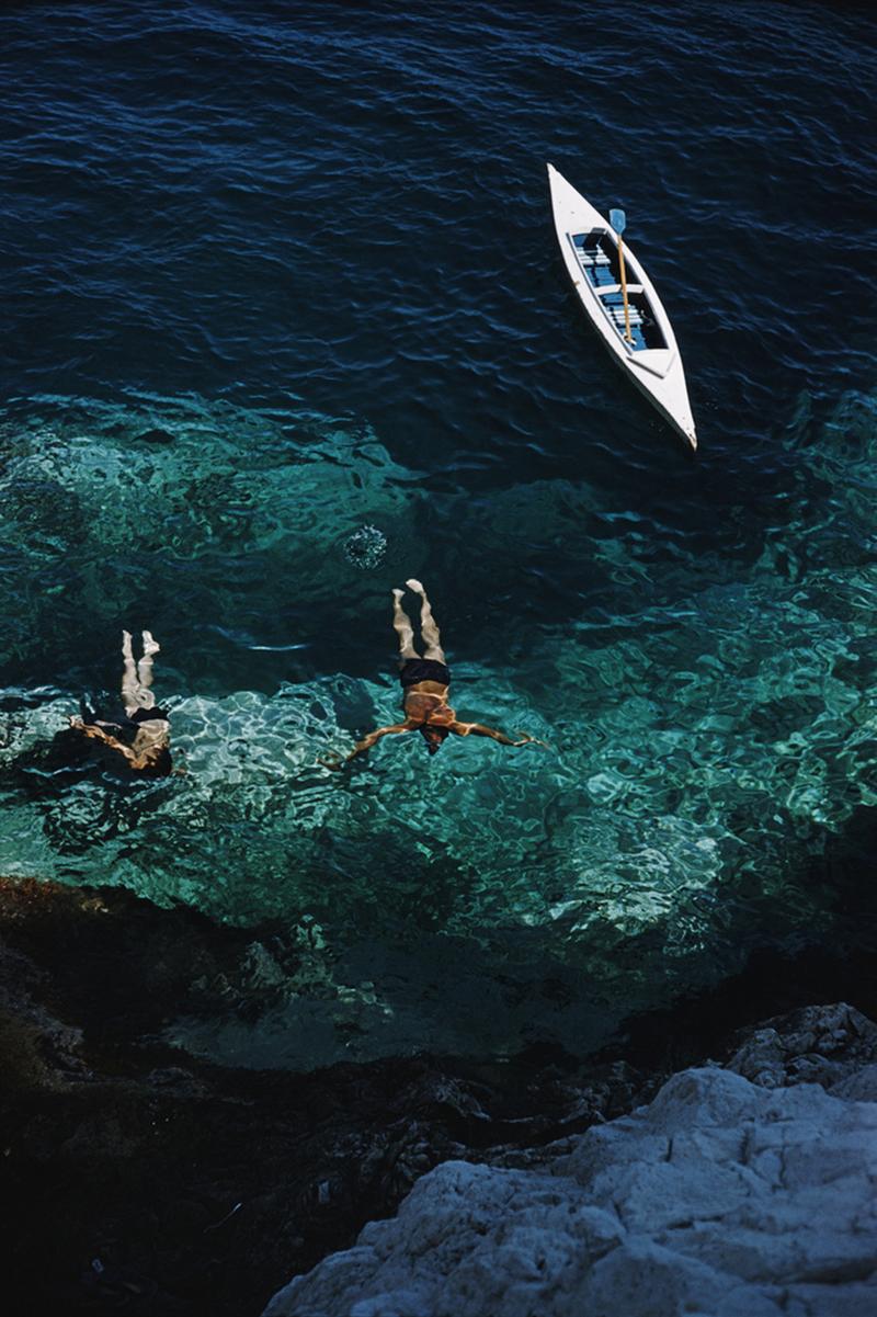 Swimmers off the Italian island of Capri, 1958. 
(Photo by Slim Aarons)

Estate Stamped Edition 
Limited to 150 only 
unframed


This photograph epitomises the travel style and glamour of the period's wealthy and famous, beautifully documented by