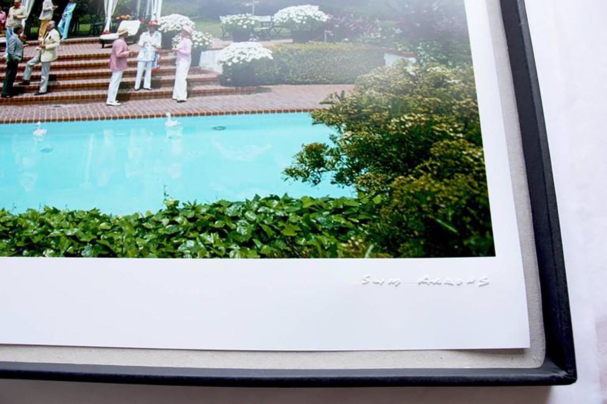 Slim Aarons Estate Stamped Edition 
Limited to 150 only 

Guests at a poolside bar at the Hotel Il Pellicano in Porto Ercole, Tuscany, August 1980 
(Photo by Slim Aarons)

This photograph epitomises the travel style and glamour of the period's