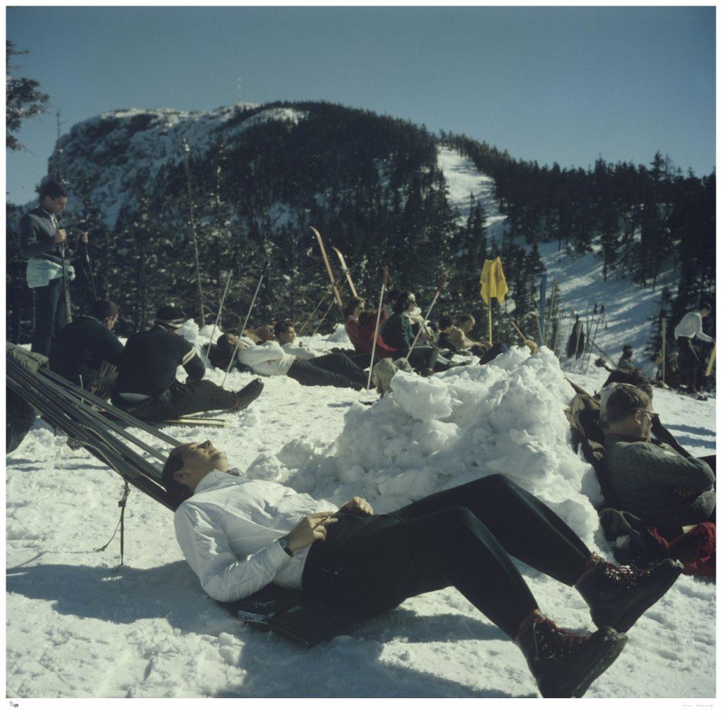 Limited Edition Estate Stamped Print (edition size 1/150).

Skiers relaxing on the slopes of the Sugarbush Mountain ski resort in Warren, Vermont, USA, circa 1960. The Sugarbush resort is one of the largest ski resorts in New England. 

This