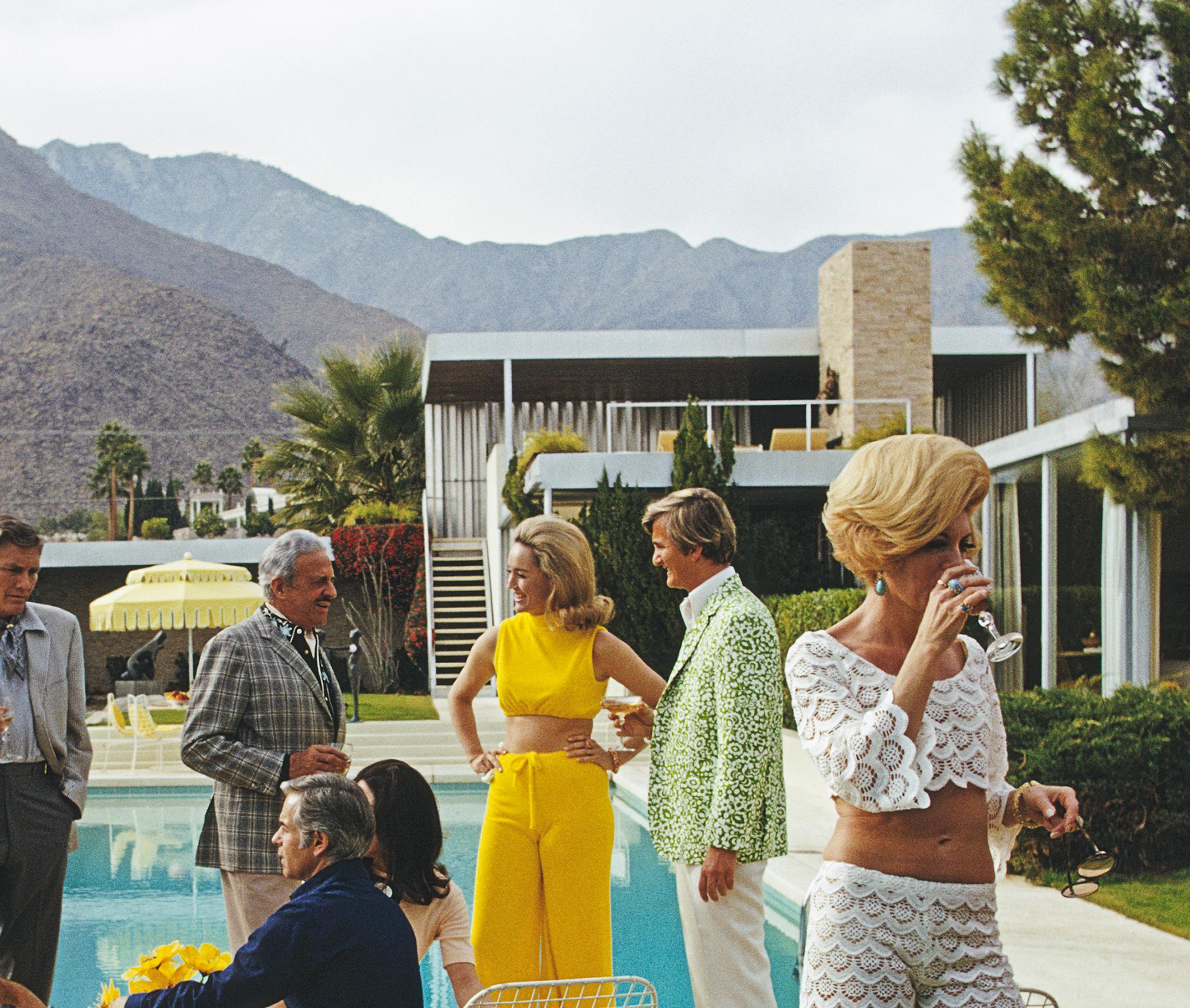 Slim Aarons Estate Print - Desert House Party - Oversize

A poolside party at a desert house, designed by Richard Neutra for Edgar J. Kaufmann, in Palm Springs, January 1970. Featured in the group are: industrial designer Raymond Loewy (1893 - 1986,