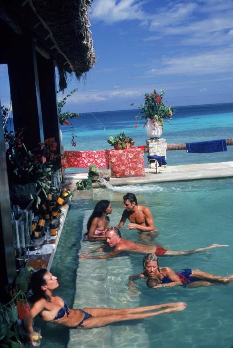 Plantation Cocoyer

People relaxing in the bar at Plantation Cocoyer, Cocoyer Beach, Haiti, February 1981.

Photo by Slim Aarons

Paper size 20 x 30 inches / 51 x 76 cm 

Slim Aarons Chromogenic C print 
Printed Later 
Slim Aarons Estate Edition
