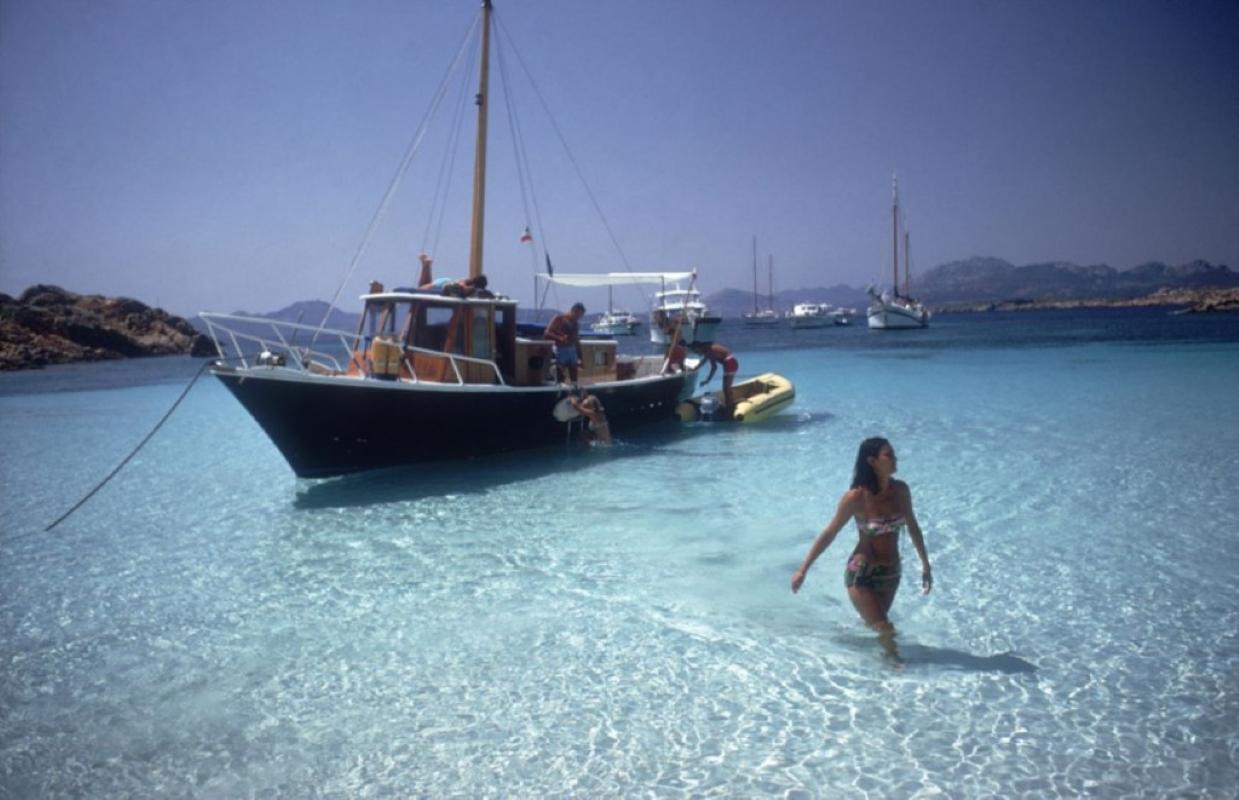 Yachting Trip

Selvaggia Borromeo wades ashore from her yacht during a holiday on the Costa Smeralda in Sardinia, August 1967.

Slim Aarons Chromogenic C print 
Printed Later 
Slim Aarons Estate Edition 
Produced utilising the only original
