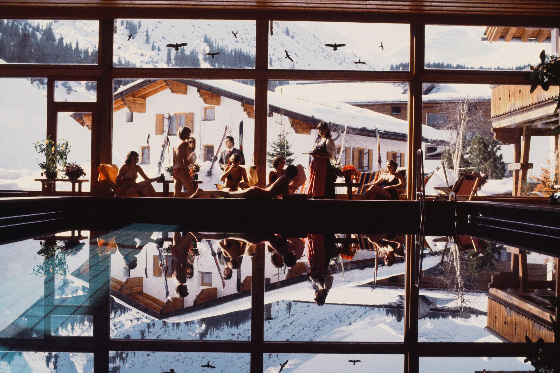 Slim Aarons
Gasthof Post Pool
1979 (printed later)
C print 
Estate stamped and numbered edition of 150 
with Certificate of authenticity

Guests lounging by the indoor swimming pool of the Gasthof Post in Lech, Austria, February 1979. (Photo by Slim
