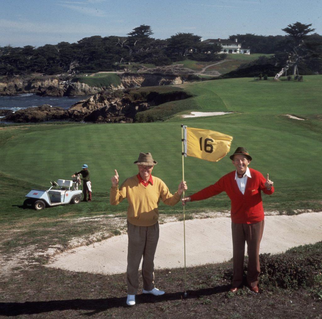 Slim Aarons - Golfing Pals - Estate Stamped

At the 16th hole on Pebble Beach golf course, singer and film star Bing Crosby (in red) and A Thomas Taylor. (Photo by Slim Aarons)

This photograph epitomises the travel style and glamour of the period's