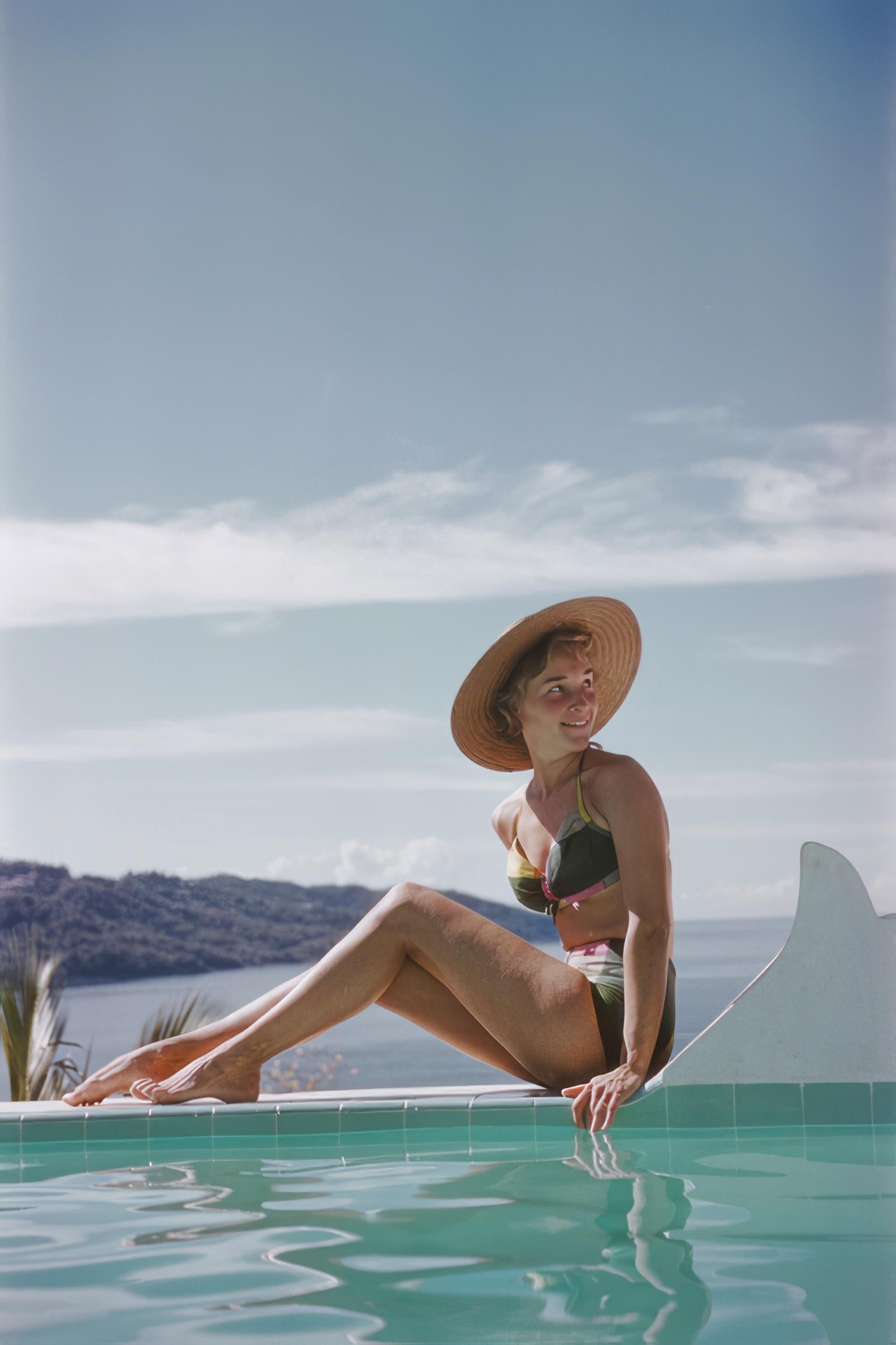 Slim Aarons
Ingrid in Acapulco
1961 (printed later)
C print
Estate stamped and hand numbered edition of 150 with certificate of authenticity from the estate.   

Ingrid Morath sunbathes by a swimming pool next to the sea in Acapulco, January 1961.
