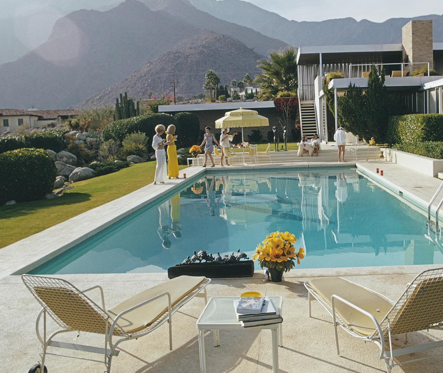 ' KAUFMANN DESERT HOUSE ' 1970 by Slim Aarons

ESTATE EDITION -

numbered and emboss stamped on front. (edition size 150 only)


Kaufmann Desert House
Former fashion model Helen Dzo Dzo Kaptur (in white lace), Nelda Linsk (in yellow), wife of art