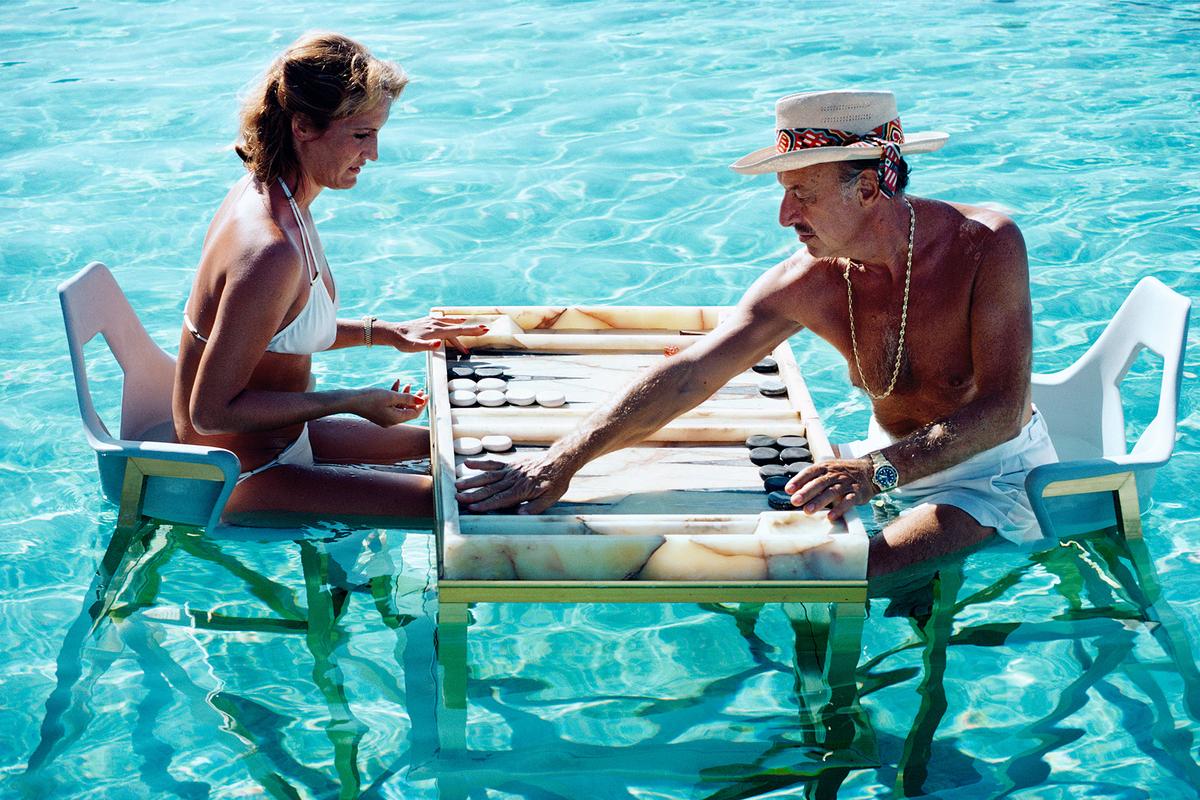 'Keep Your Cool' 1978 Slim Aarons Limited Estate Edition

Carmen Alvarez enjoying a game of backgammon with Frank ‘Brandy’ Brandstetter 
in a swimming pool at Acapulco.

Slim Aarons Chromogenic C print 
Printed Later 
Slim Aarons Estate Edition