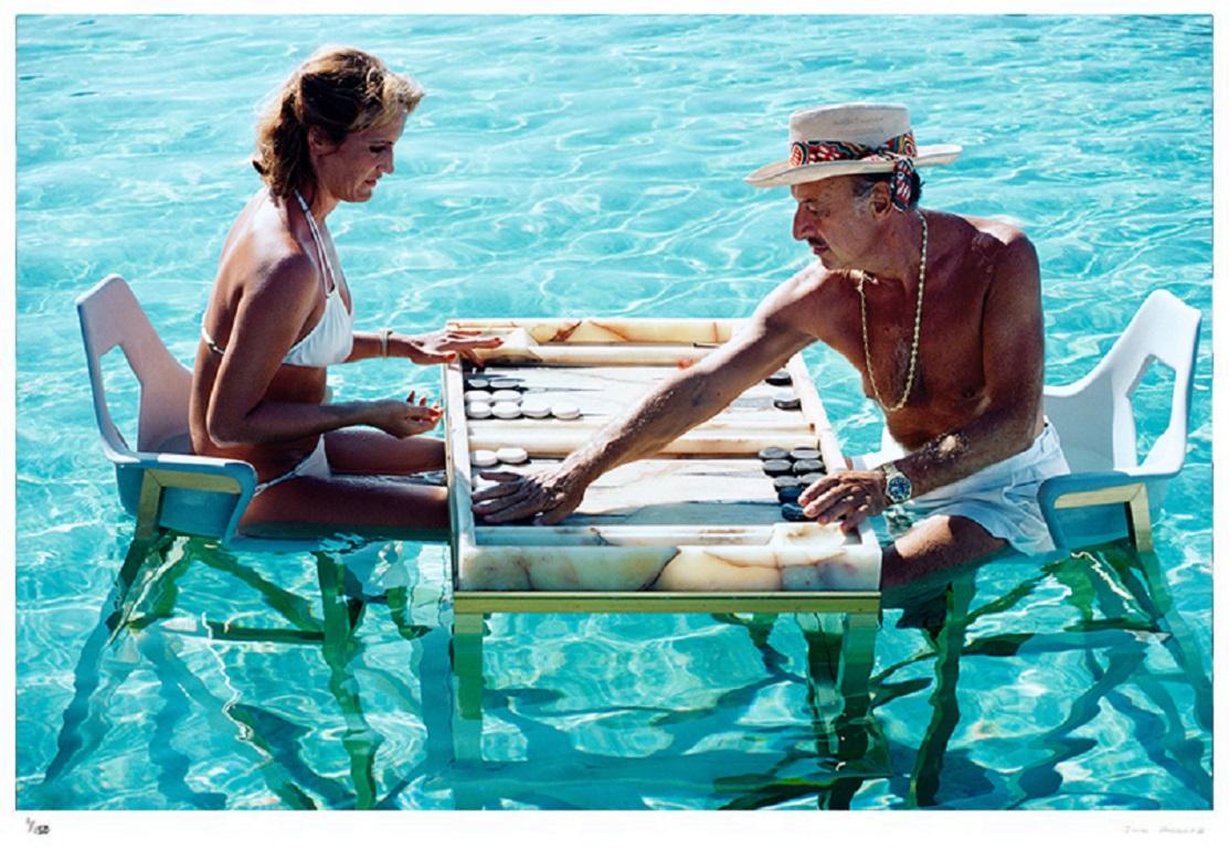 Keep Your Cool

Carmen Alvarez enjoying a game of backgammon with Frank ‘Brandy’ Brandstetter in a swimming pool at Acapulco, 1978.

(Photo by Slim Aarons)

Unframed (Premium Collection) Limited Edition Estate Stamped Print
(Full framing service