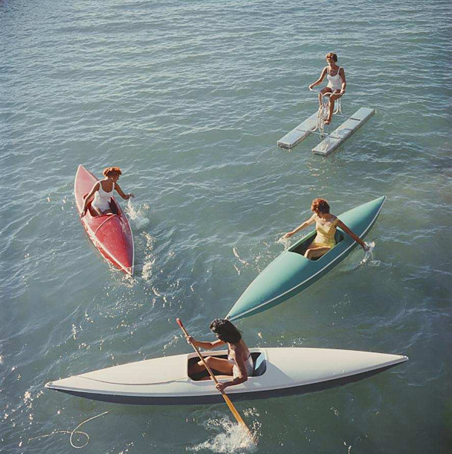 Young women canoeing at Zephyr Cove on the Nevada side of Lake Tahoe, USA, 1959.

Lake Tahoe Trip
Slim Aarons Estate Edition
Numbered and stamped by the Slim Aarons Estate. 
Certificate of Authenticity included. 

Complimentary dealer shipping to