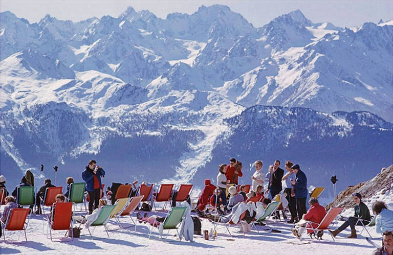 Holidaymakers in sun loungers at Verbier, Switzerland, February 1964.

Estate stamped and hand numbered edition of 150 with certificate of authenticity from the estate. 

Slim Aarons (1916-2006) worked mainly for society publications photographing