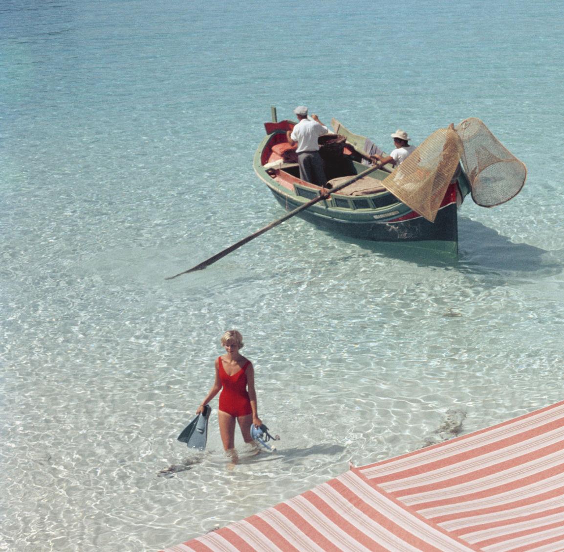 Marietine Birnie after a day snorkeling at the Blue Lagoon, Kemmuna (Comina), Malta, July 1959.

Slim Aarons
Marietine Birnie,  Blue Lagoon, Kemmuna 
Chromogenic Lambda Print
Slim Aarons Estate Edition

48 x 48 inches
$4500

40 x 40 inches
$3950

30