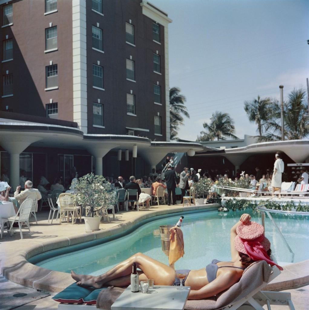 Slim Aarons - Palm Beach - Estate Stamped
imited Edition Estate Stamped Print (edition size 1/150). The pool at the Colony Hotel in Palm Beach, Florida, USA, 1955. (Photo by Slim Aarons)

This photograph epitomises the travel style and glamour of