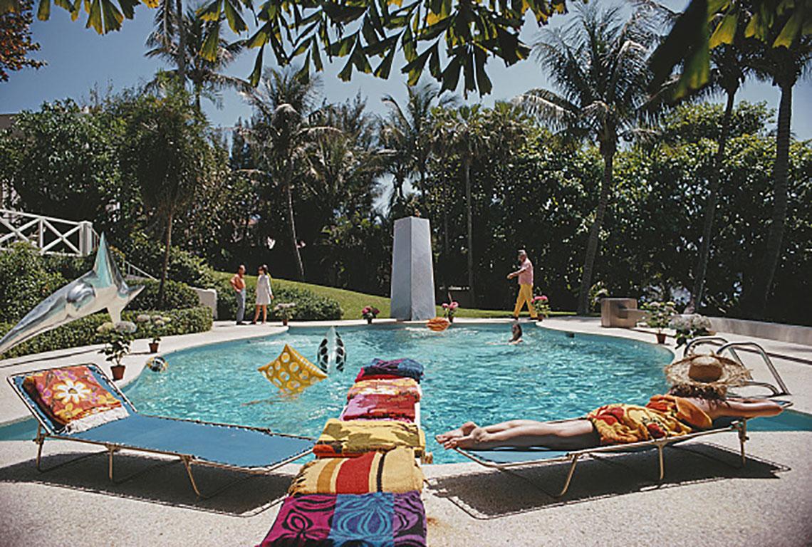 Slim Aarons
Pool at the Four Winds
1968 (printed later)
C print 
Estate stamped and numbered edition of 150 
with Certificate of authenticity

Bathers around the pool at 'Four Winds', the home of J. Patrick Lannan, in Palm Beach, Florida, April