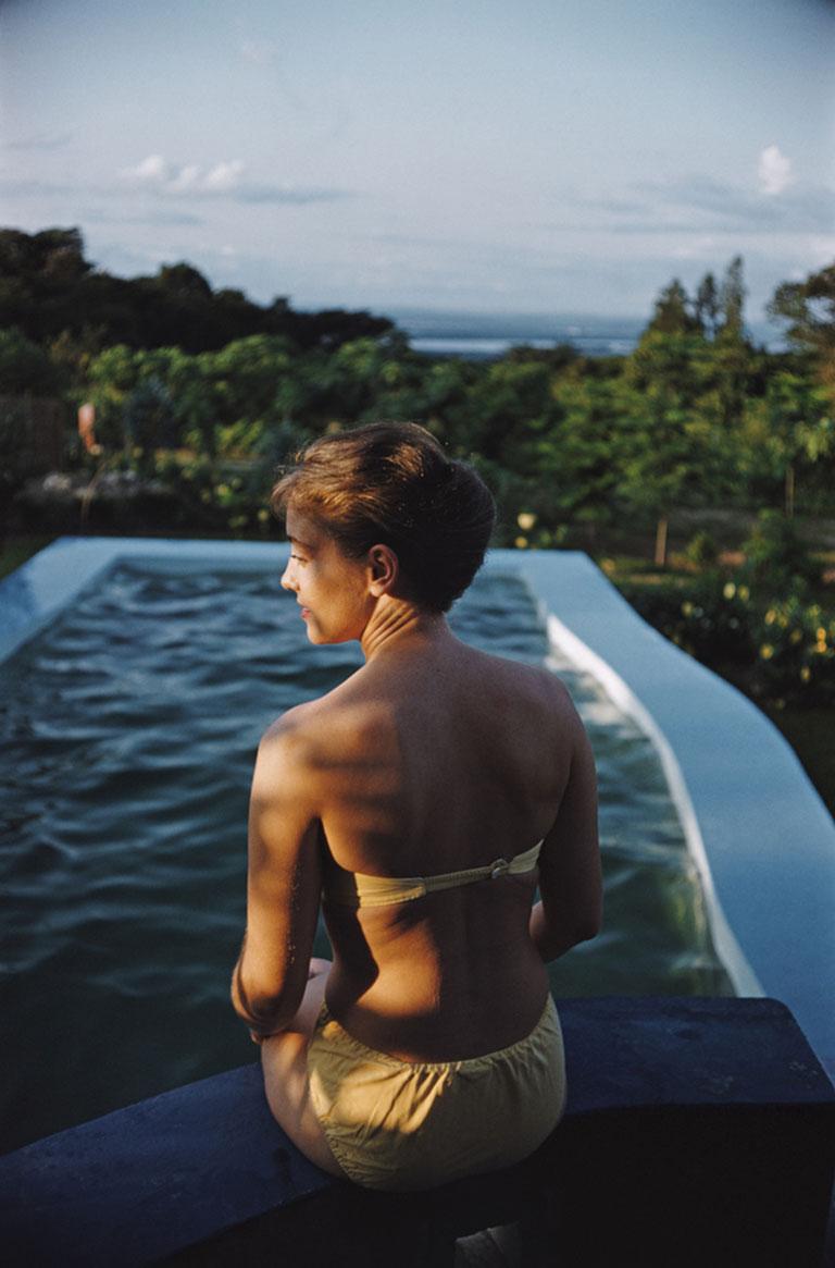 Poolside In Kenya, 1958
Chromogenic Lambda Print
Estate edition of 150

A woman sits at the edge of a swimming pool in Kenya, December 1958.

Estate stamped and hand numbered edition of 150 with certificate of authenticity from the estate. 

Slim