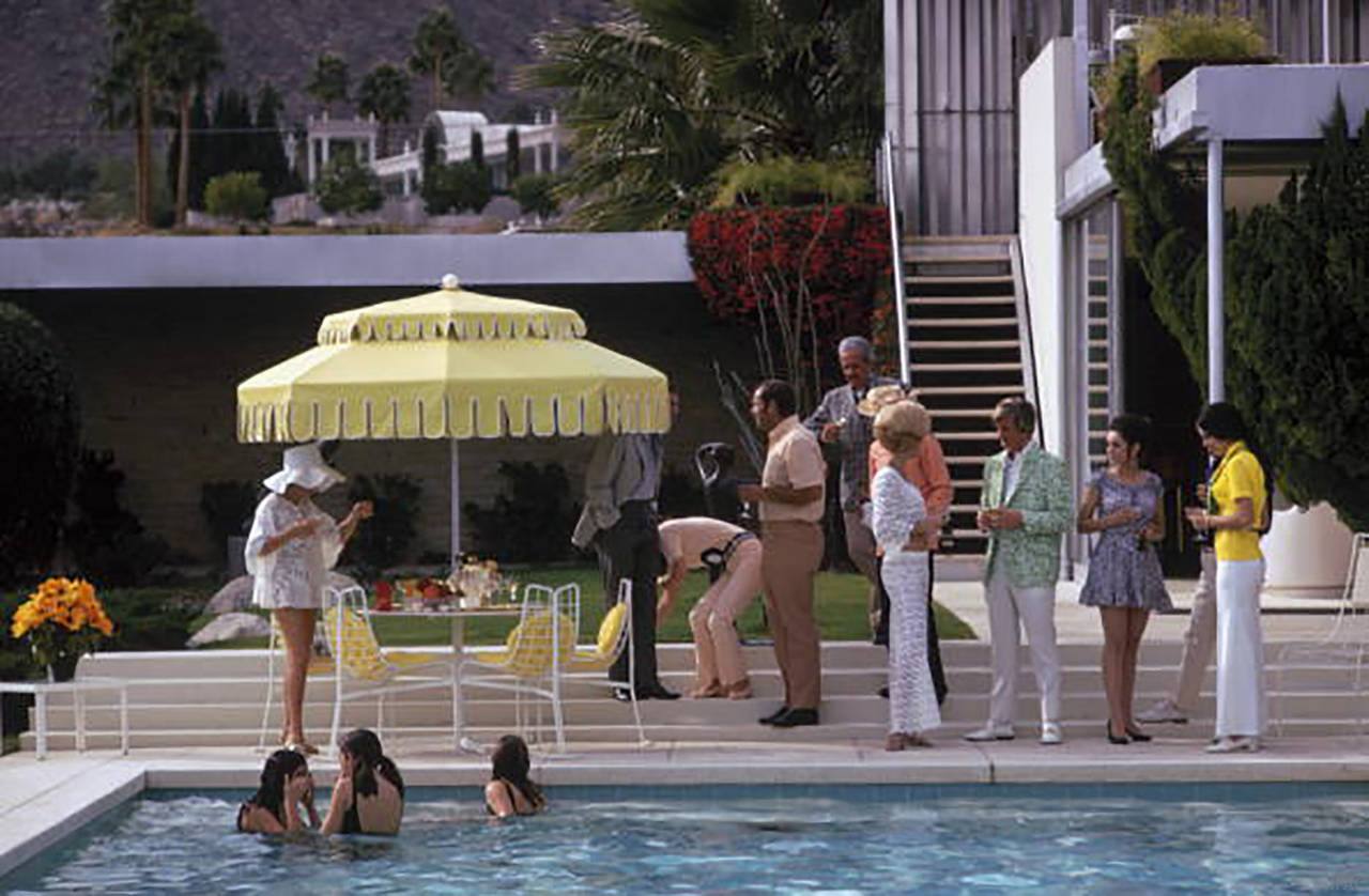 Guests by the pool at Nelda Linsk's desert house in Palm Springs, January 1970. The house was designed by Richard Neutra for Edgar Kaufman 

Estate stamped and hand numbered edition of 150 with certificate of authenticity from the estate. 

Slim