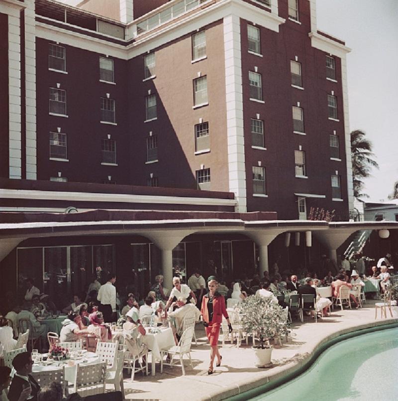 'Poolside Promenade' 1961 Slim Aarons Limited Estate Edition Print 
A fashion show at the Colony Hotel in Palm Beach, Florida, 1961. 

Paper Size  40 x 40 inches / 101 x 101 cm 
Printed in 2024 - produced from the original transparency
Certificate