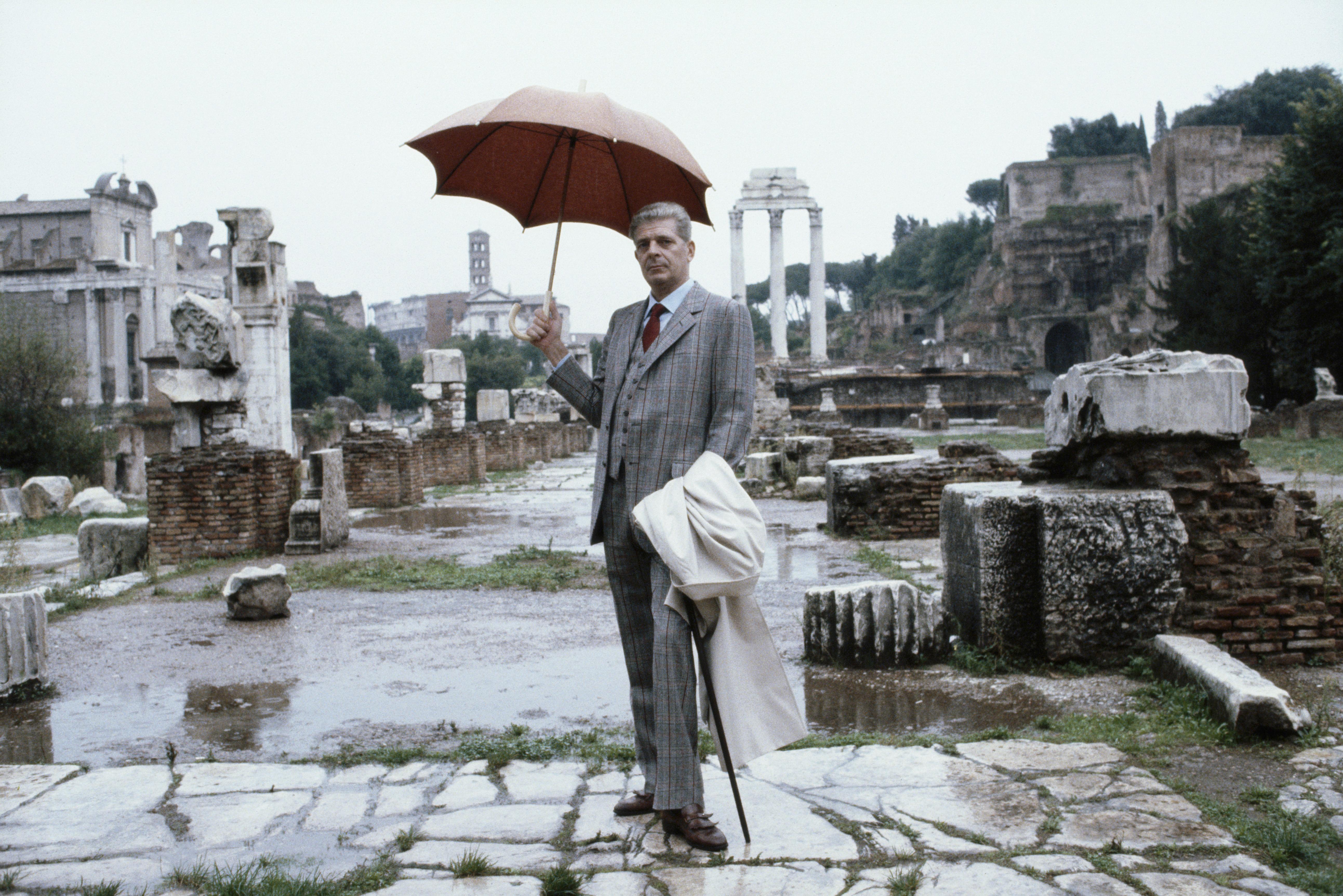 Slim Aarons
Prince Torlonia
1984
Chromogenic Lambda Print
Estate stamped and hand numbered edition of 150 with certificate of authenticity from the estate. 

Prince Torlonia, sheltering beneath an umbrella, poses in the Roman Forum in Rome, Italy,