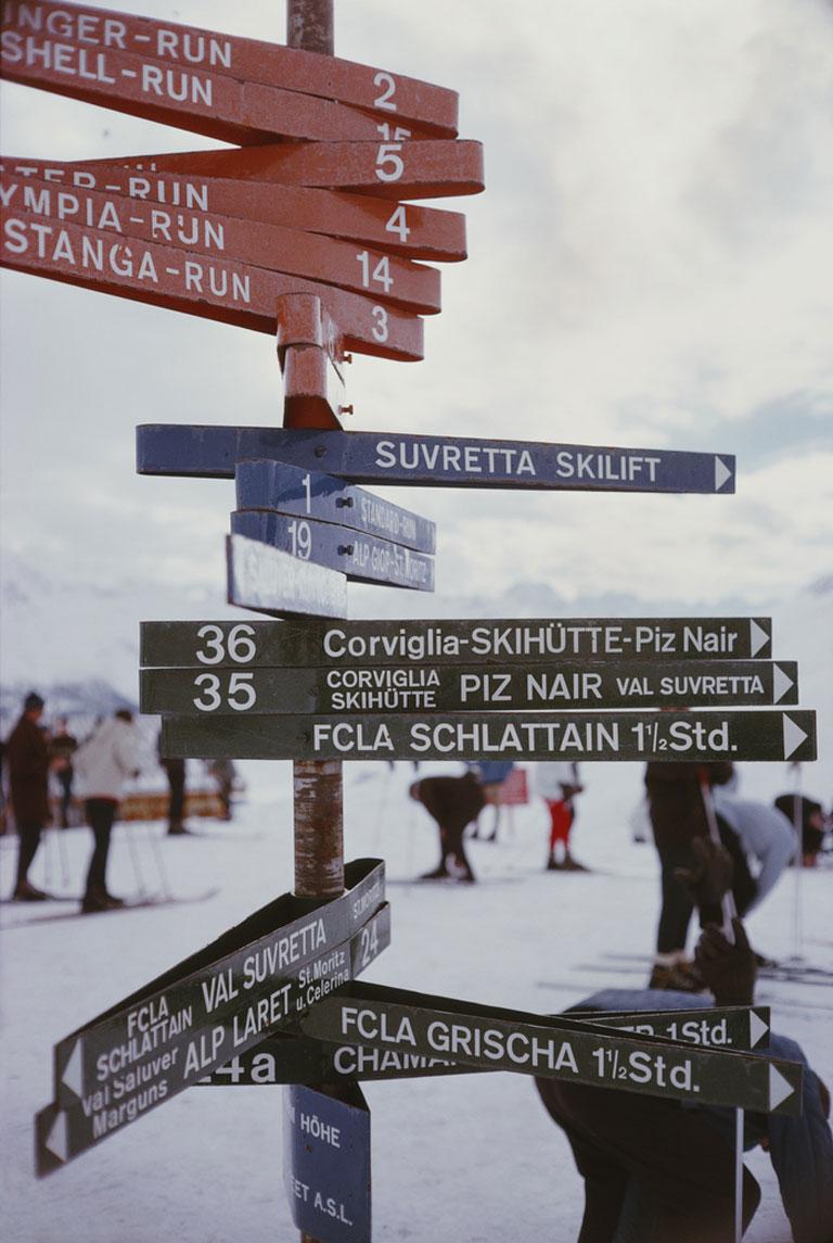 Poolside In Kenya, 1958
Chromogenic Lambda Print
Estate edition of 150

A signpost indicating various ski slopes and toboggan tracks in the resort of St Moritz, Switzerland, March 1963. 

Estate stamped and hand numbered edition of 150 with