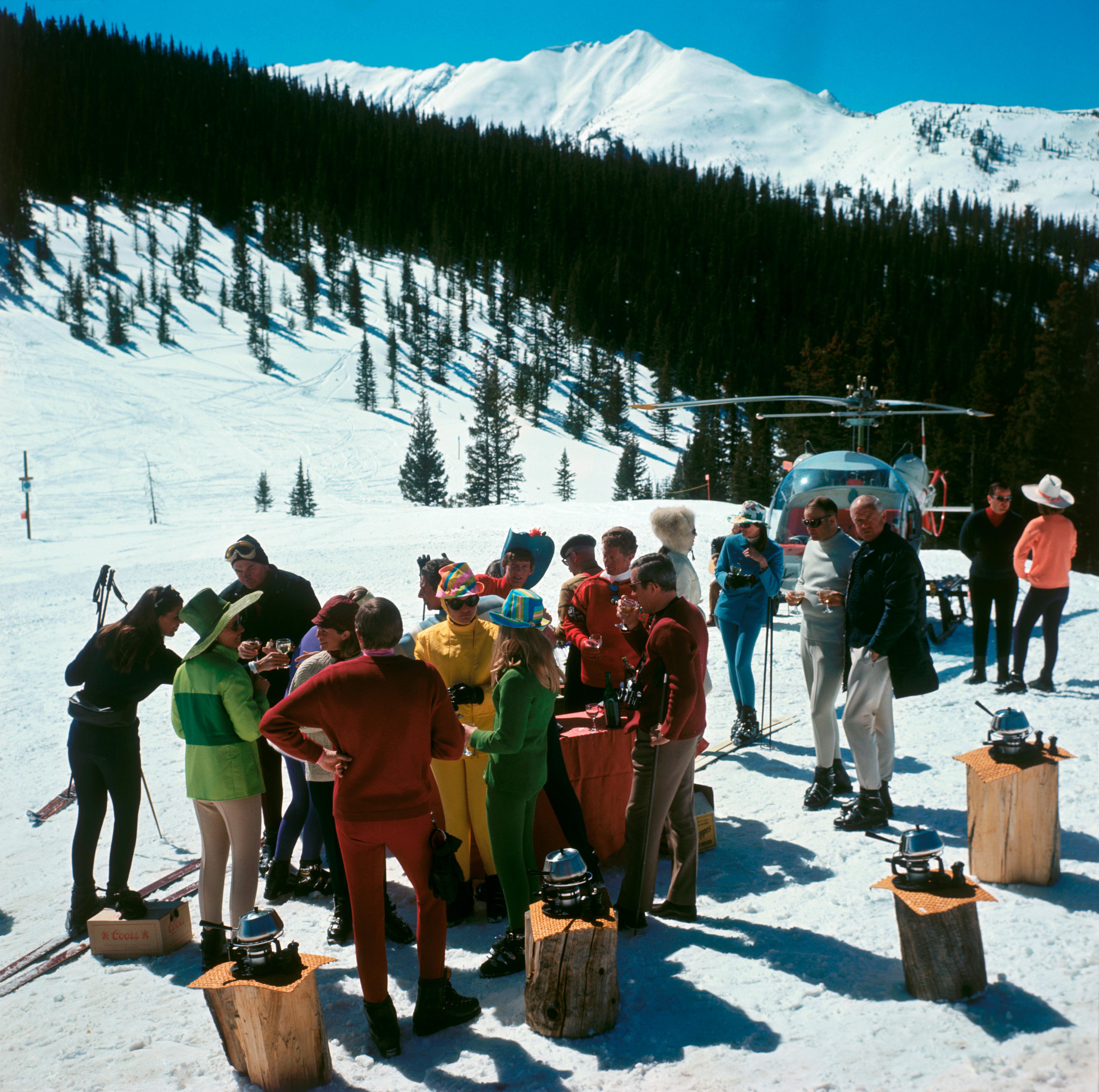 Snowmass Picnic
1967
Chromogenic Lambda Print
Estate edition of 150

1967: A stand-up fondue picnic for skiers at Snowmass-at-Aspen, Colorado which has more than fifty miles of trails and snowfields. The village was opened in 1967. The ski picnic