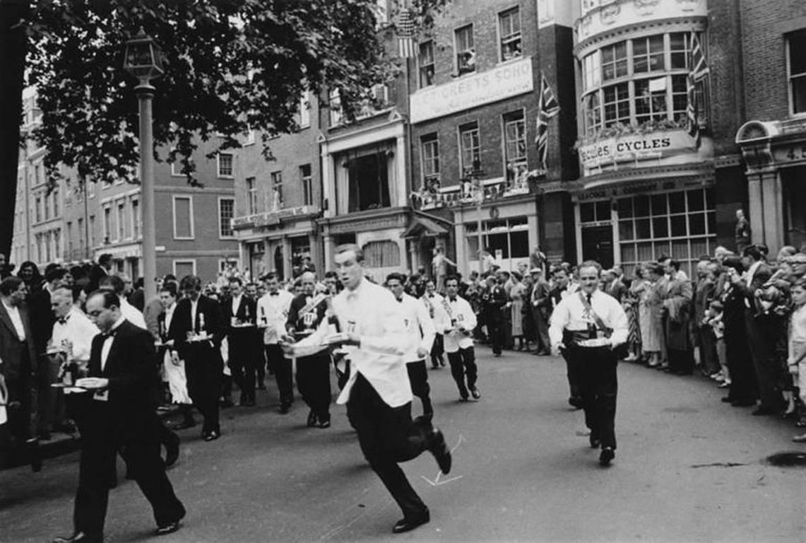 Soho Waiters Race, 1955, Printed Later

Waiters carrying half bottles of champagne set off on the annual waiters' race from Soho Square to Greek Street, in London's Soho, 1955
 
 Estate stamped and hand numbered edition of 150 with certificate of