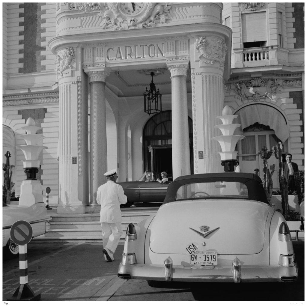 The Carlton Hotel by Slim Aarons

A Cadillac with Florida plates parked outside the Carlton Hotel, Cannes, France, circa 1955.

Another gorgeous and typically 'Slim' photograph, it epitomises the elegant, vintage style and glamour of the period.