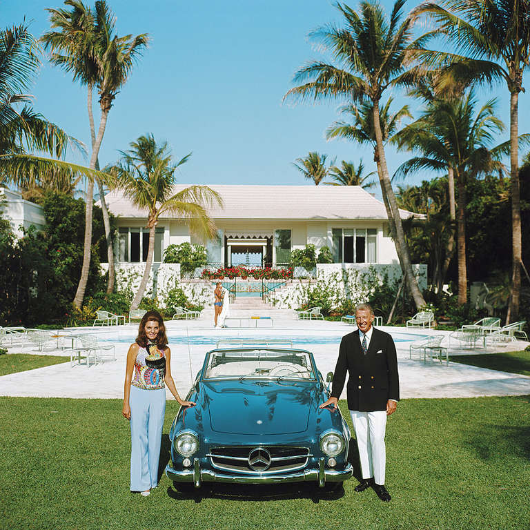 May 1970: Alvin and Lilly Fuller outside their new home in Palm Beach, Florida, pose with their fashionable European sports car, the Mercedes 190SL

Estate stamped and hand numbered edition of 150 with certificate of authenticity from the estate.  