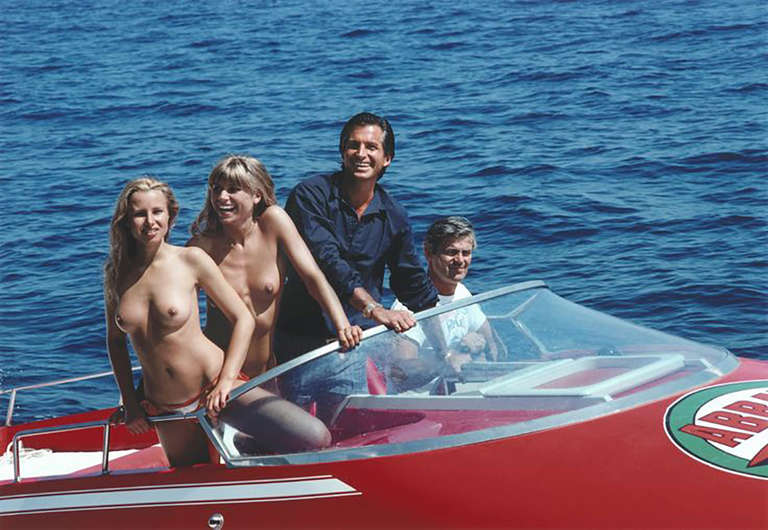 The High Life
1968
C print
20 x 24 inches
Estate stamped and hand numbered edition of 150
with certificate of authenticity

Actor George Hamilton (in blue) takes off in a speedboat with friends Ruth Luthi, Sabine Korte and Mike Belami, during a stay