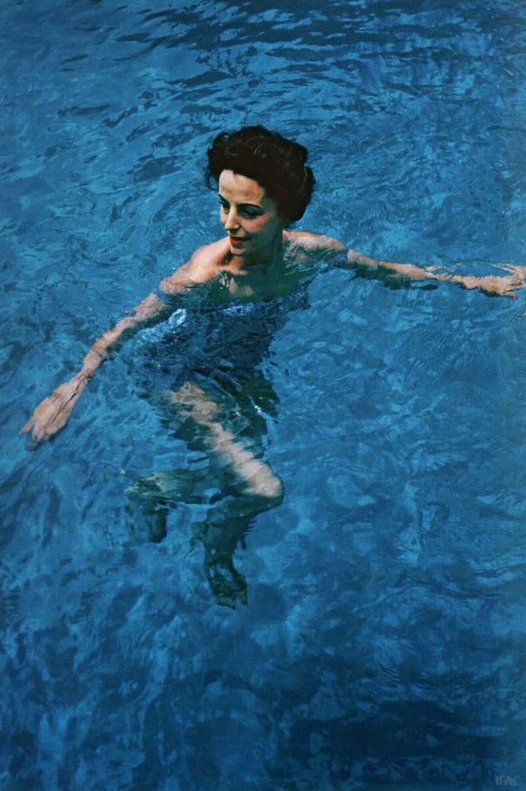 Caption: April 1959: Gloria Guinness enjoying a swim in her pool at Manalapan, Palm Beach, Florida.

Estate stamped and hand numbered edition of 150 with certificate of authenticity from the estate. 

Slim Aarons (1916-2006) worked mainly for