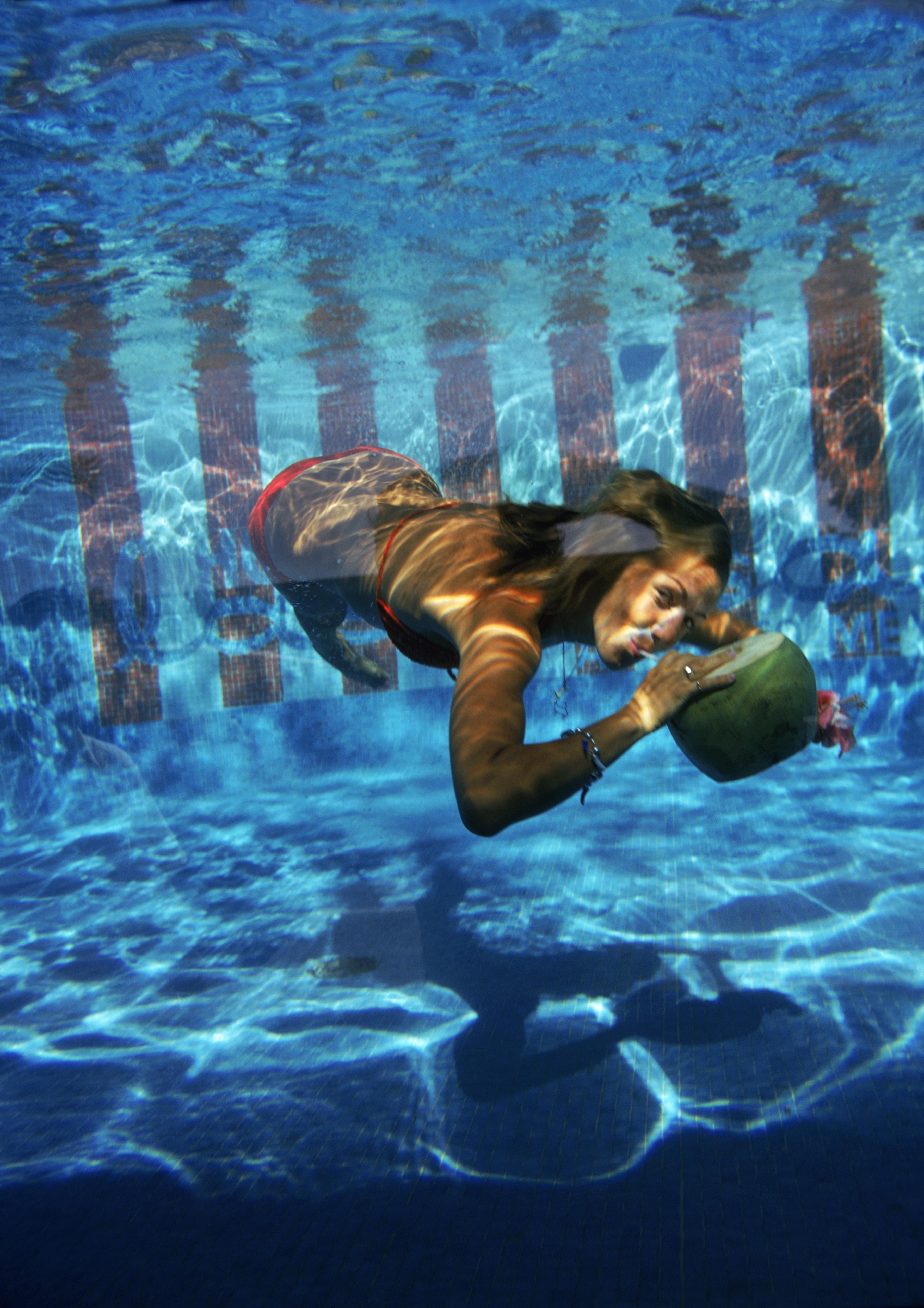 Slim Aarons
Underwater Drink
1972 (printed later)
C print 
Estate stamped and numbered edition of 150 
with Certificate of authenticity

A woman drinking from a coconut underwater in the pool at Las Brisas Hotel in Acapulco, Mexico, February