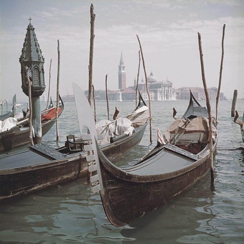 Venice Gondolas
1957 (printed later)
Chromogenic Lambda Print
Estate signature stamped and hand numbered edition of 150 with certificate of authenticity from the Slim Aarons estate

CAPTION: Gondolas moored in Venice, 1957. In the background is the
