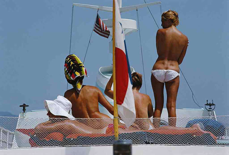 Tanned bodies on the deck of Dino Pecci Blunt's yacht in Marbella, 1967

Estate stamped and hand numbered edition of 150 with certificate of authenticity from the estate. 

Slim Aarons (1916-2006) worked mainly for society publications photographing