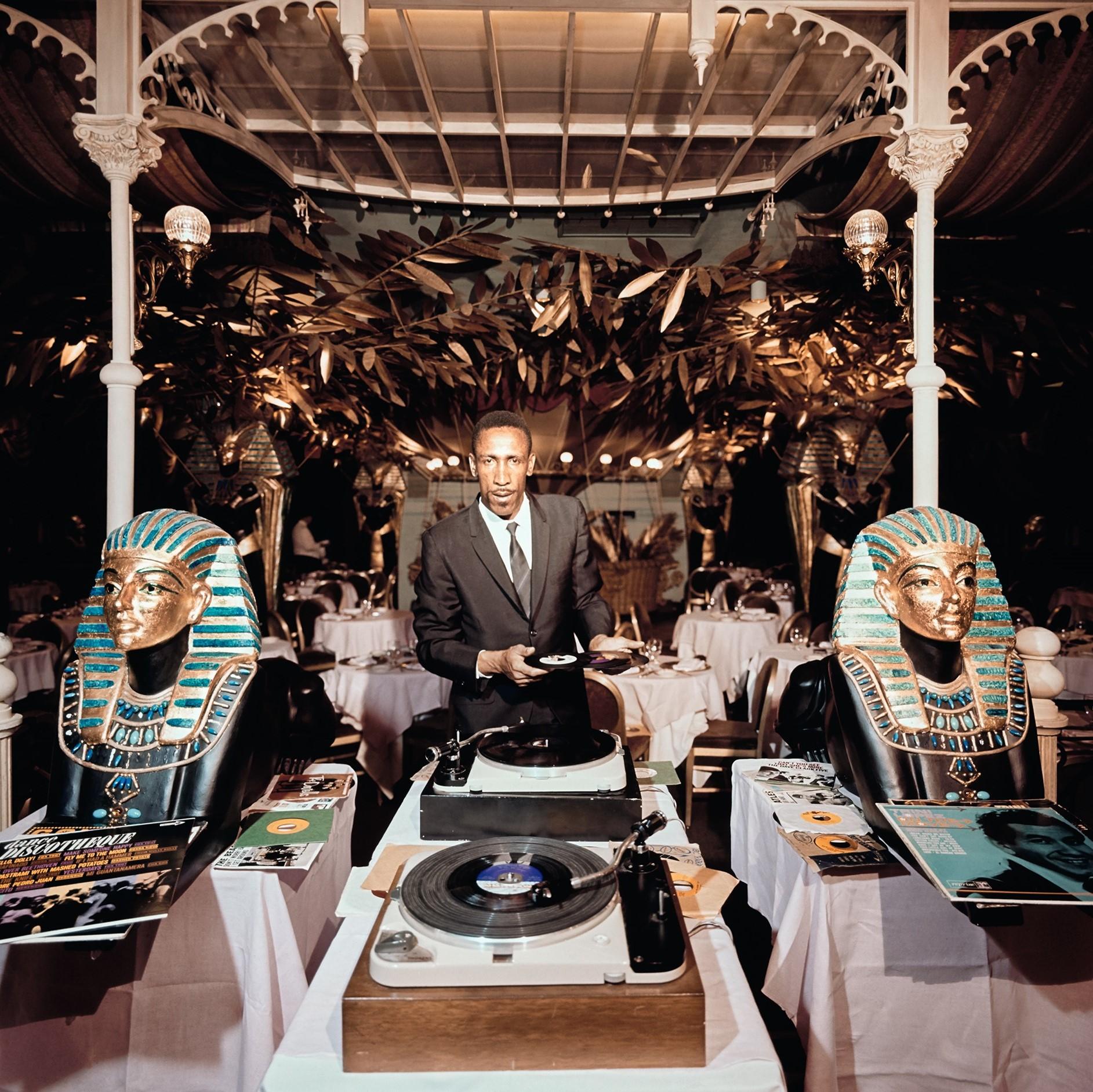 Slim Aarons Color Photograph - Slim and Sphinx, Estate Edition: New York DJ Slim Hyatt at Shepheard's