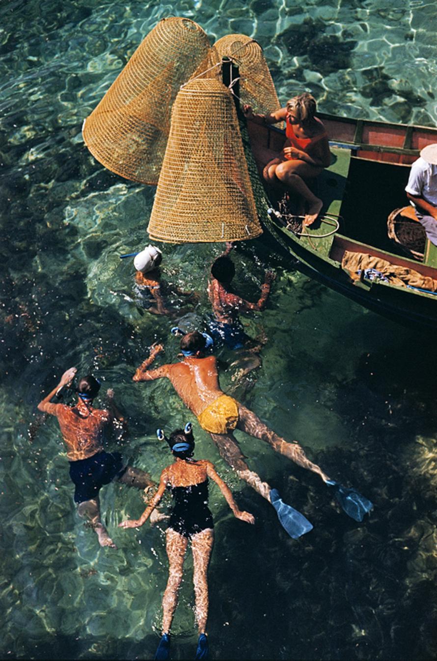 Snorkelling In Malta 
1959
by Slim Aarons

Slim Aarons Limited Estate Edition

A group of people snorkelling off a small boat in Malta, 1959.

unframed
c type print
printed 2023
24 x 20"  - paper size

Limited to 150 prints only – regardless of