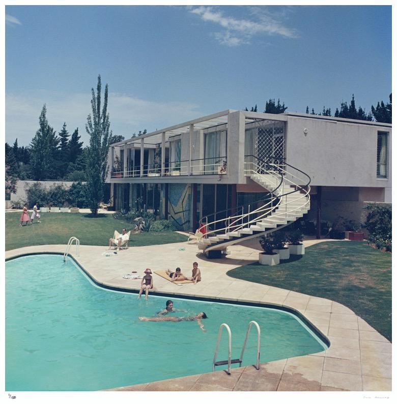 South Africa Swimming Pool 1958 - Slim Aarons Estate Edition 

A luxury house in South Africa with stairs leading to the swimming pool in the garden, 1958.

Produced from the original transparency
Certificate of authenticity supplied 
Archive