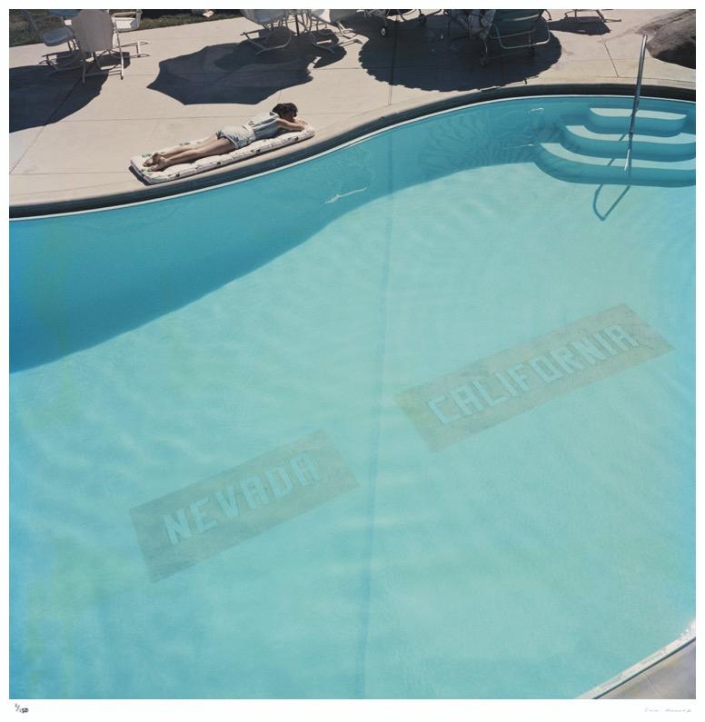  State Line 1959 Slim Aarons Estate Edition

A swimming pool near Lake Tahoe, USA, circa 1959. The line on the bottom of the pool marks the state line between Nevada and California. 

Produced from the original transparency
Certificate of