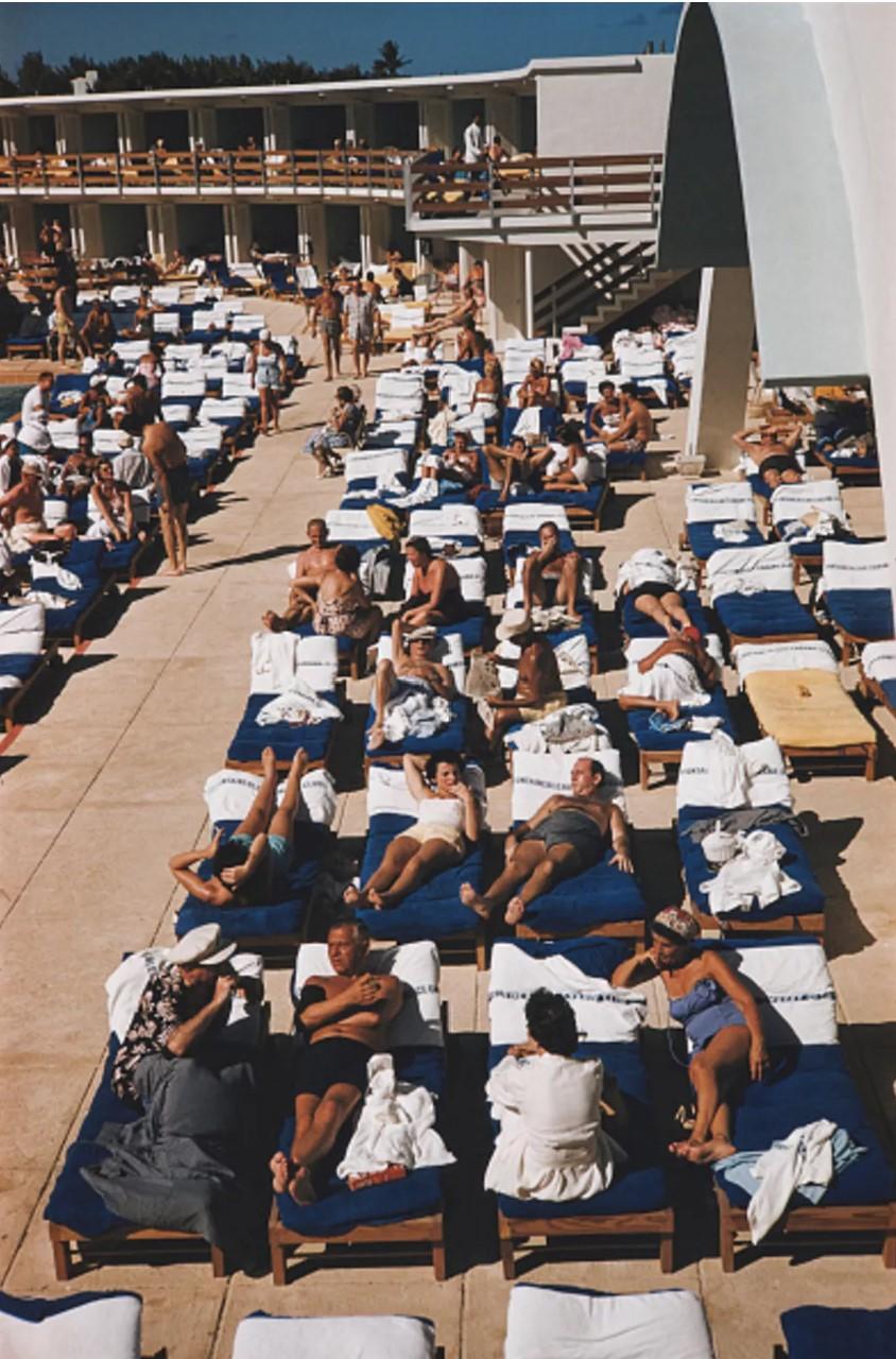 Slim Aarons Color Photograph - Sunbathers in Miami, 1955 - Sunbathers at the Fontainebleau Hotel in Miami