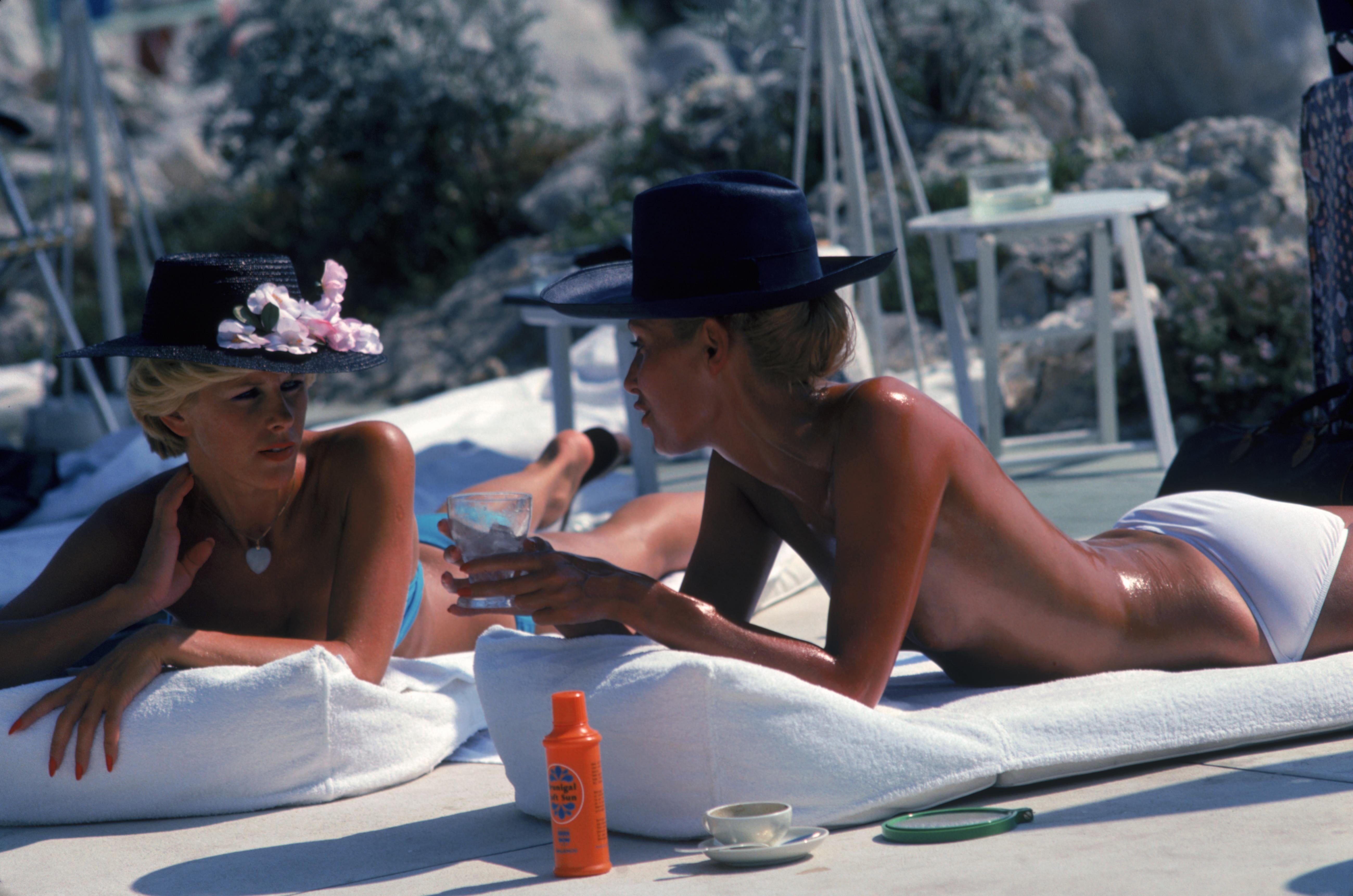 'Sunbathing In Antibes' 1976 Slim Aarons Limited Estate Edition

Dani Geneux (left) and Marie-Eugenie Gaudfrin sunbathing at the Hotel du Cap Eden-Roc, Antibes, France, August 1976. 

Produced from the original transparency
Certificate of