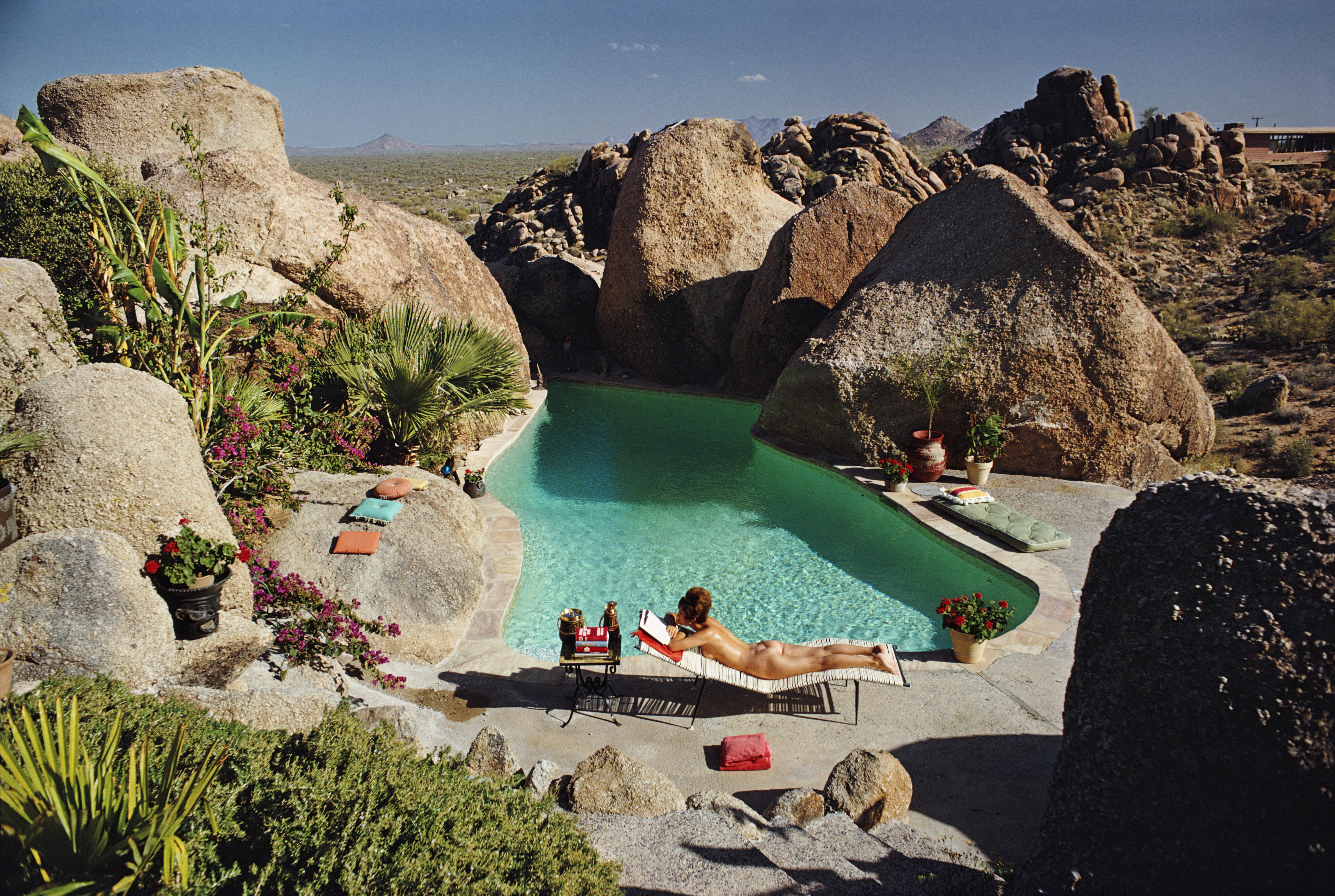 'Sunbathing In Arizona' 1967 Slim Aarons Limited Estate Edition Print 

A woman sunbathing nude by Tom Darlington's pool in Carefree, Arizona, April 1967. 

Produced from the original transparency
Certificate of authenticity supplied 
Archive