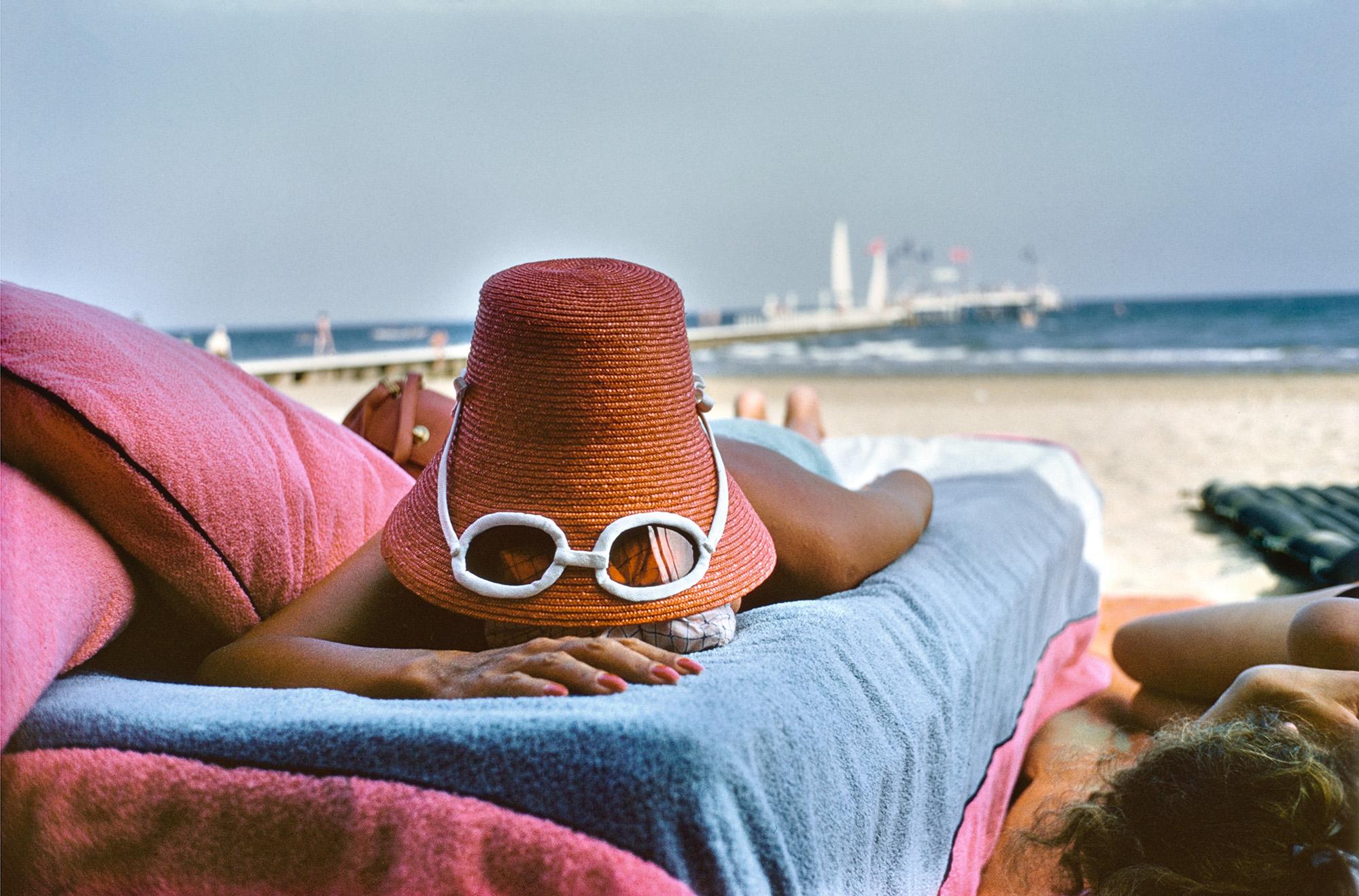 Slim Aarons Landscape Photograph - Sunbathing in Venice, 1954 - Venetian Nude Sunbathing in Vintage Italian Fashion