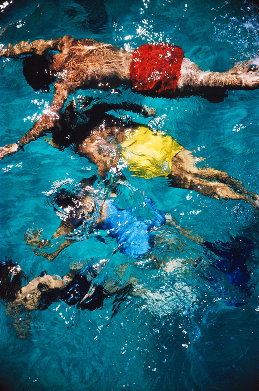 Swimming In The Bahamas 
1959
by Slim Aarons

Slim Aarons Limited Estate Edition


Brightly coloured swimmers in a pool in Nassau on the island of New Providence in the Bahamas, 1959

unframed
c type print
printed 2023
20 × 16 inches - paper