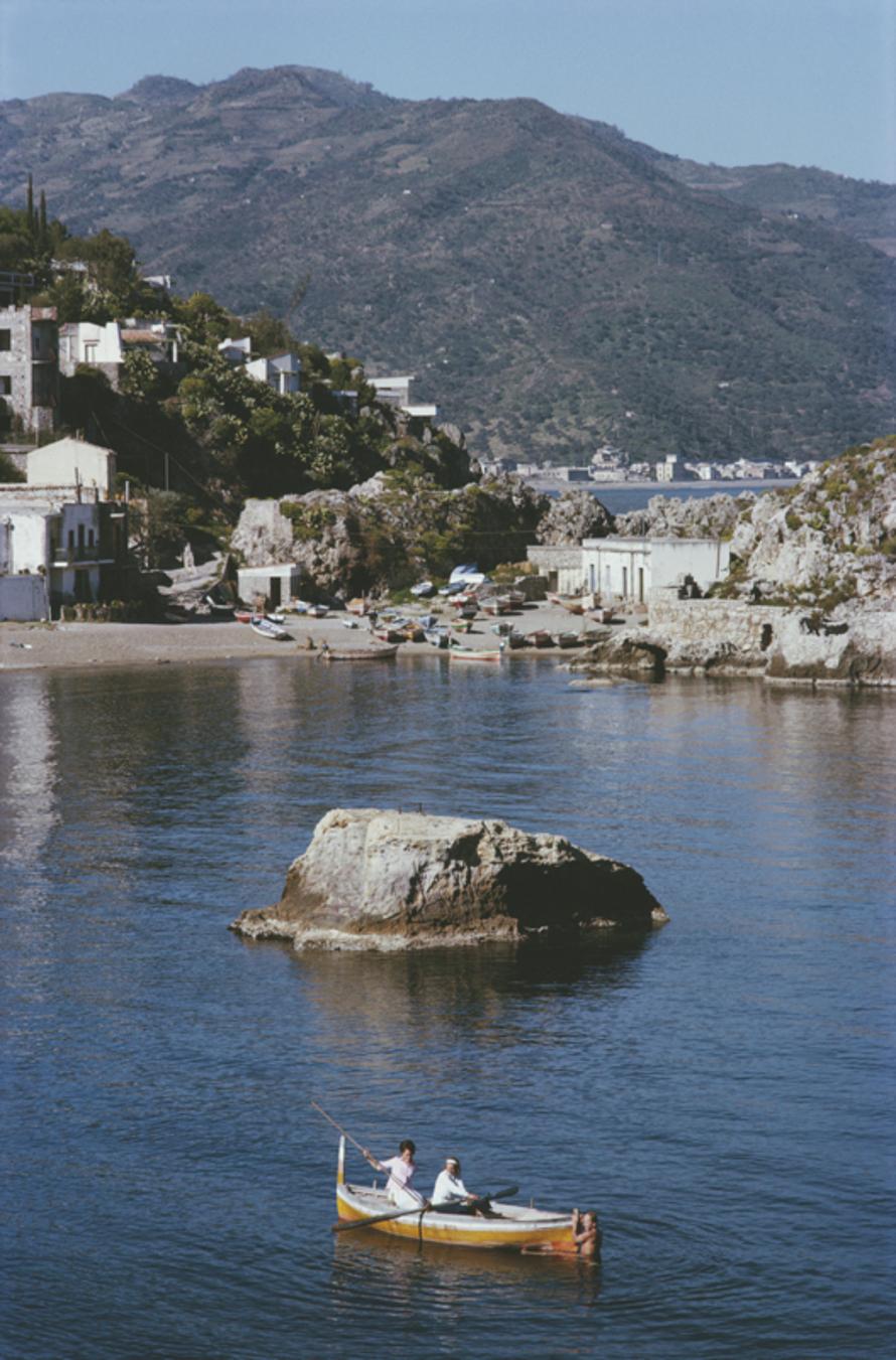 Taormina 
1963
by Slim Aarons

Slim Aarons Limited Estate Edition

The coastal town of Taormina in Sicily, Italy, March 1963. 

unframed
c type print
printed 2023
24 x 20"  - paper size

Limited to 150 prints only – regardless of paper size

blind