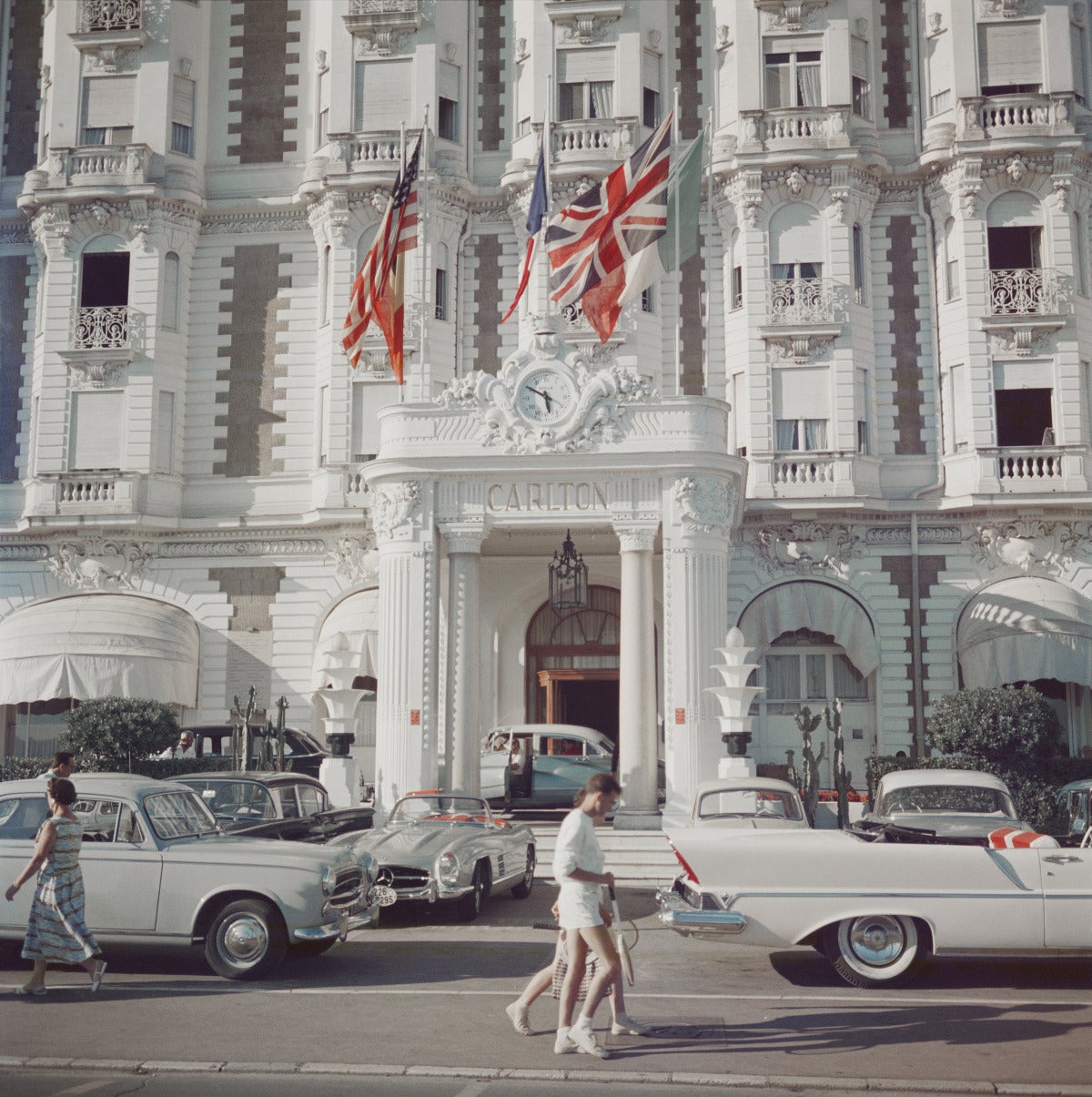 Carlton Hotel
1958 (printed later)
C print
50 x 50 inches 
Estate stamped and hand numbered edition of 150 with certificate of authenticity from the estate. 

The entrance to the Carlton Hotel, Cannes, France, 1958. 

Print is also available in 16 x