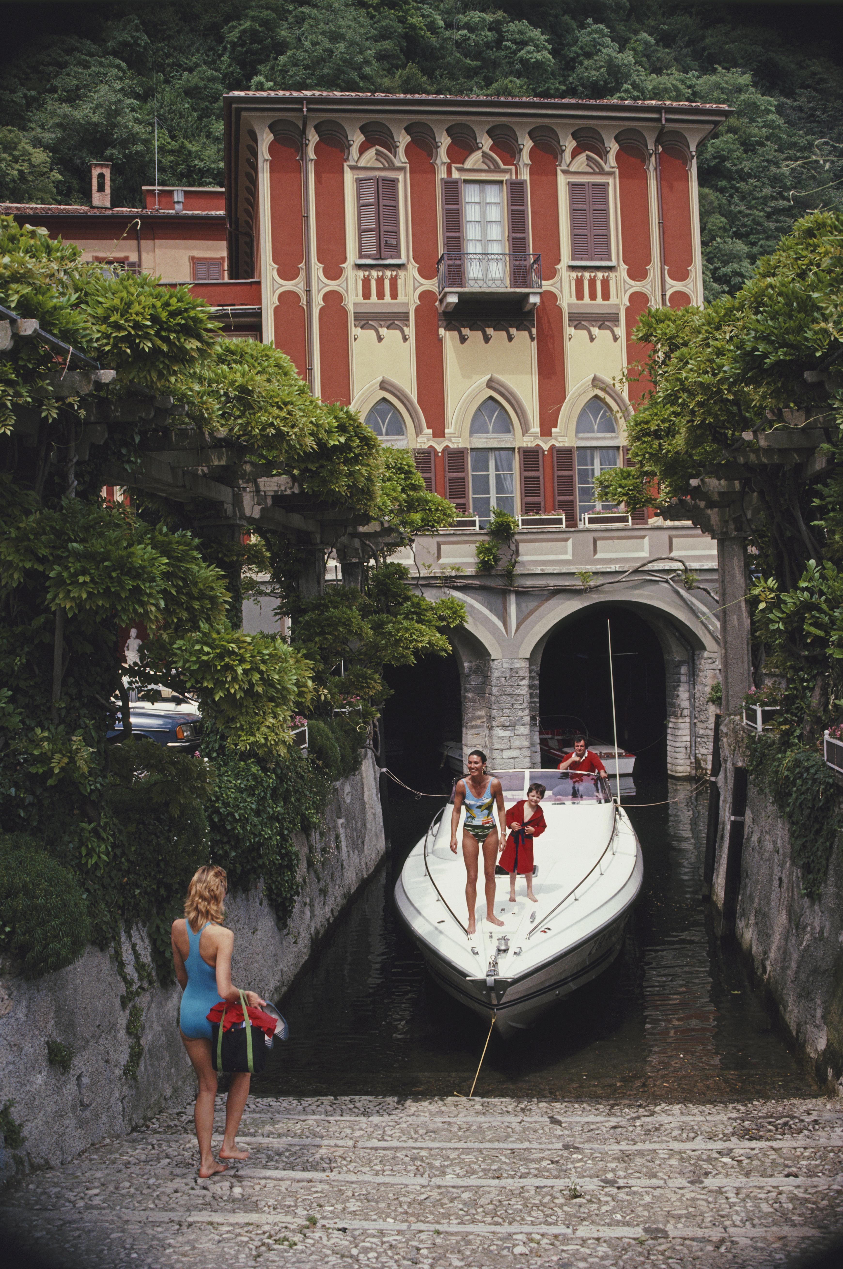 'Tullio Abbate'  1983 Slim Aarons Limited Estate Edition Print 

Tullio Abbate, of Abbate Boats, at the back of yacht as it is moored at a property on the shores of Lake Como, Italy, in June 1983. 

Produced from the original